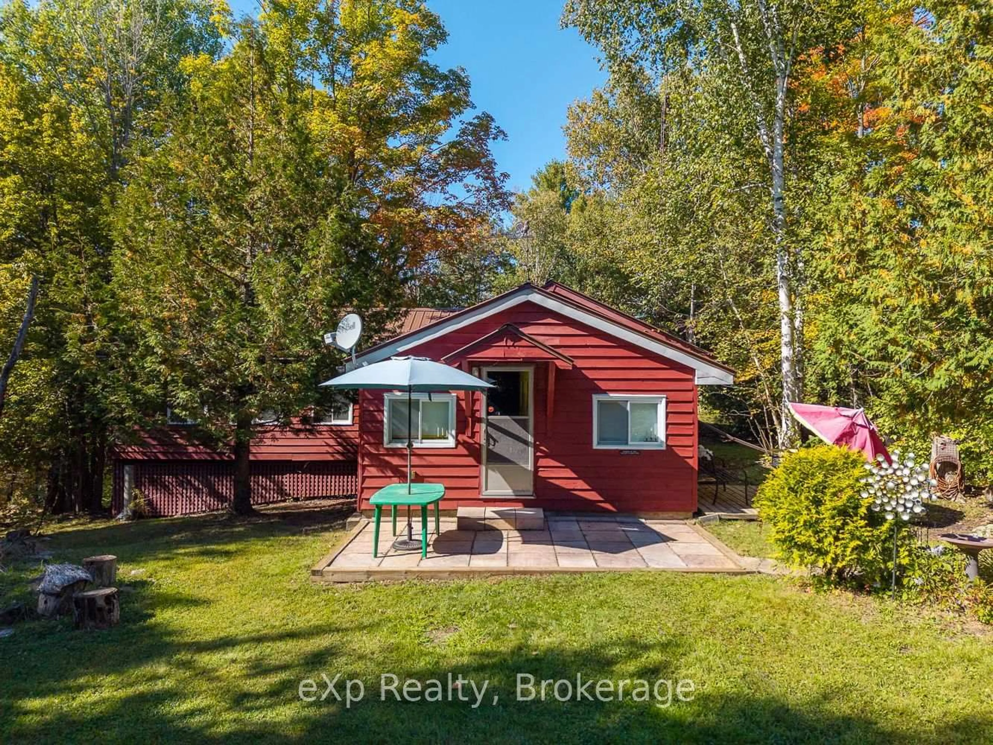 A pic from outside/outdoor area/front of a property/back of a property/a pic from drone, forest/trees view for 32 McKellar Lake Rd, McKellar Ontario P0G 1C0