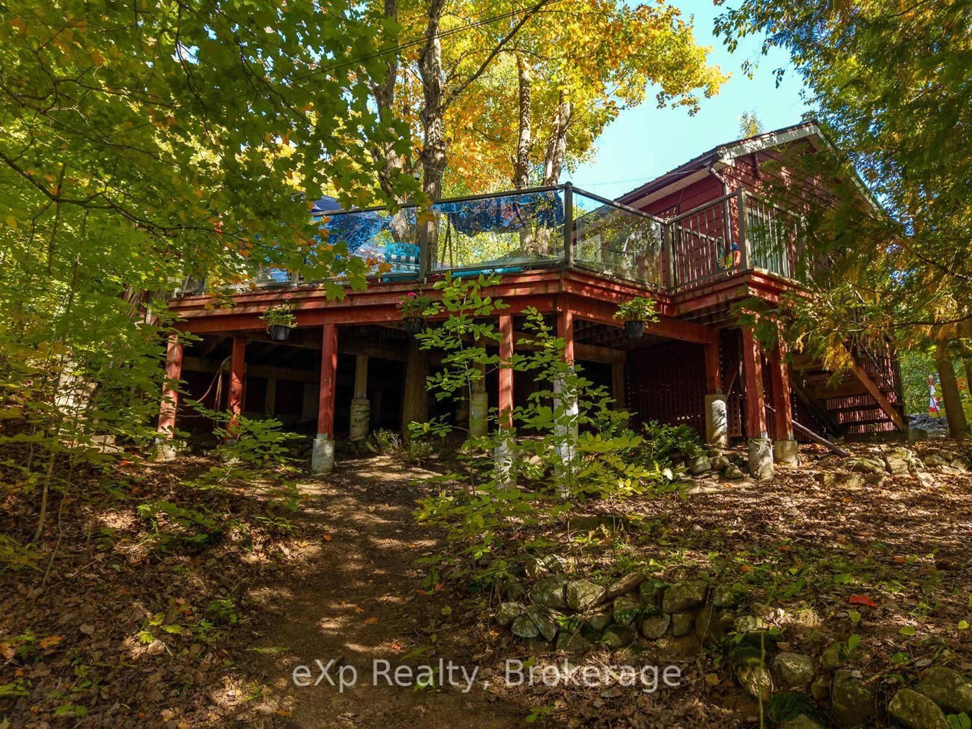 A pic from outside/outdoor area/front of a property/back of a property/a pic from drone, forest/trees view for 32 McKellar Lake Rd, McKellar Ontario P0G 1C0