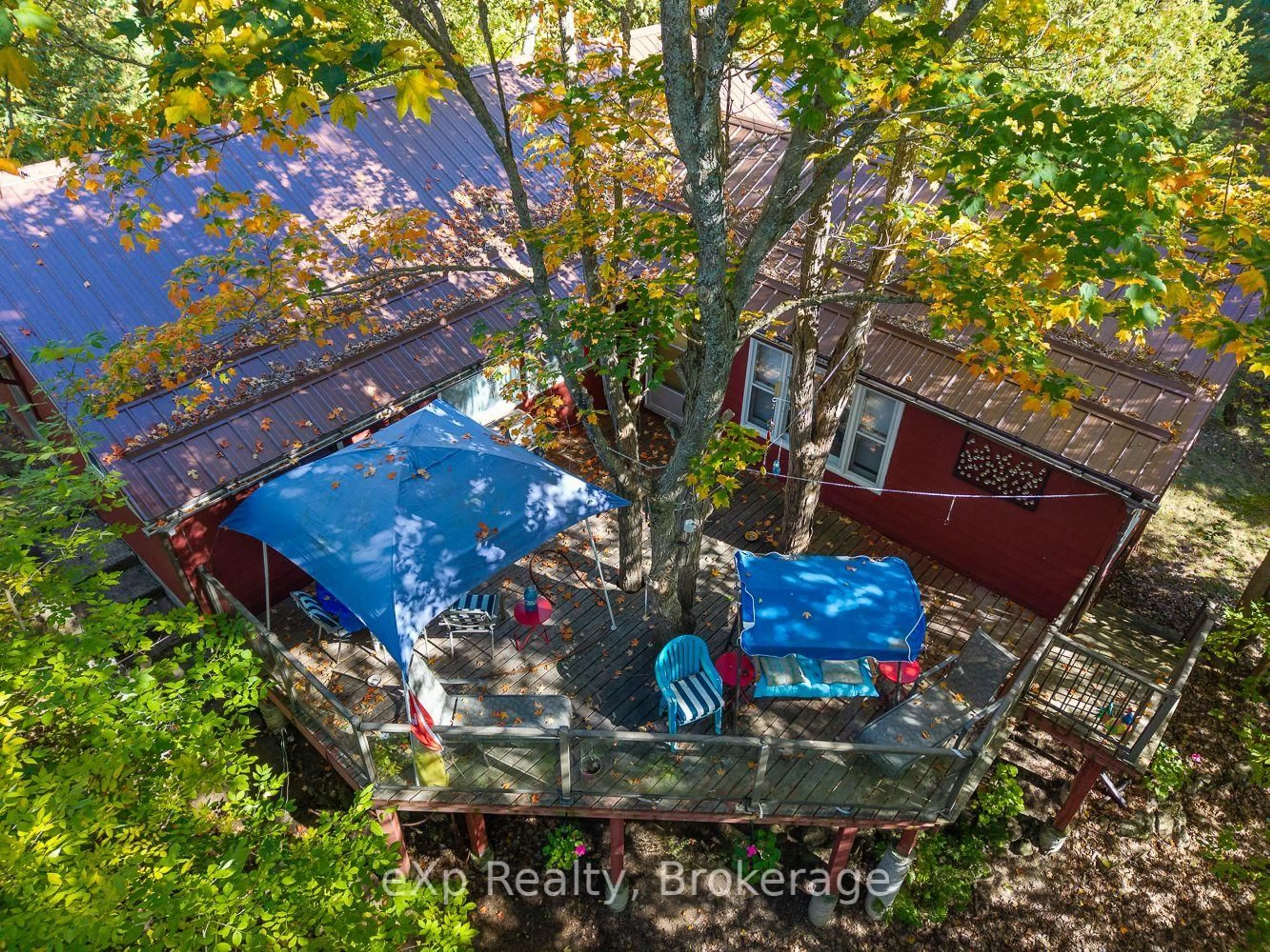 A pic from outside/outdoor area/front of a property/back of a property/a pic from drone, forest/trees view for 32 McKellar Lake Rd, McKellar Ontario P0G 1C0