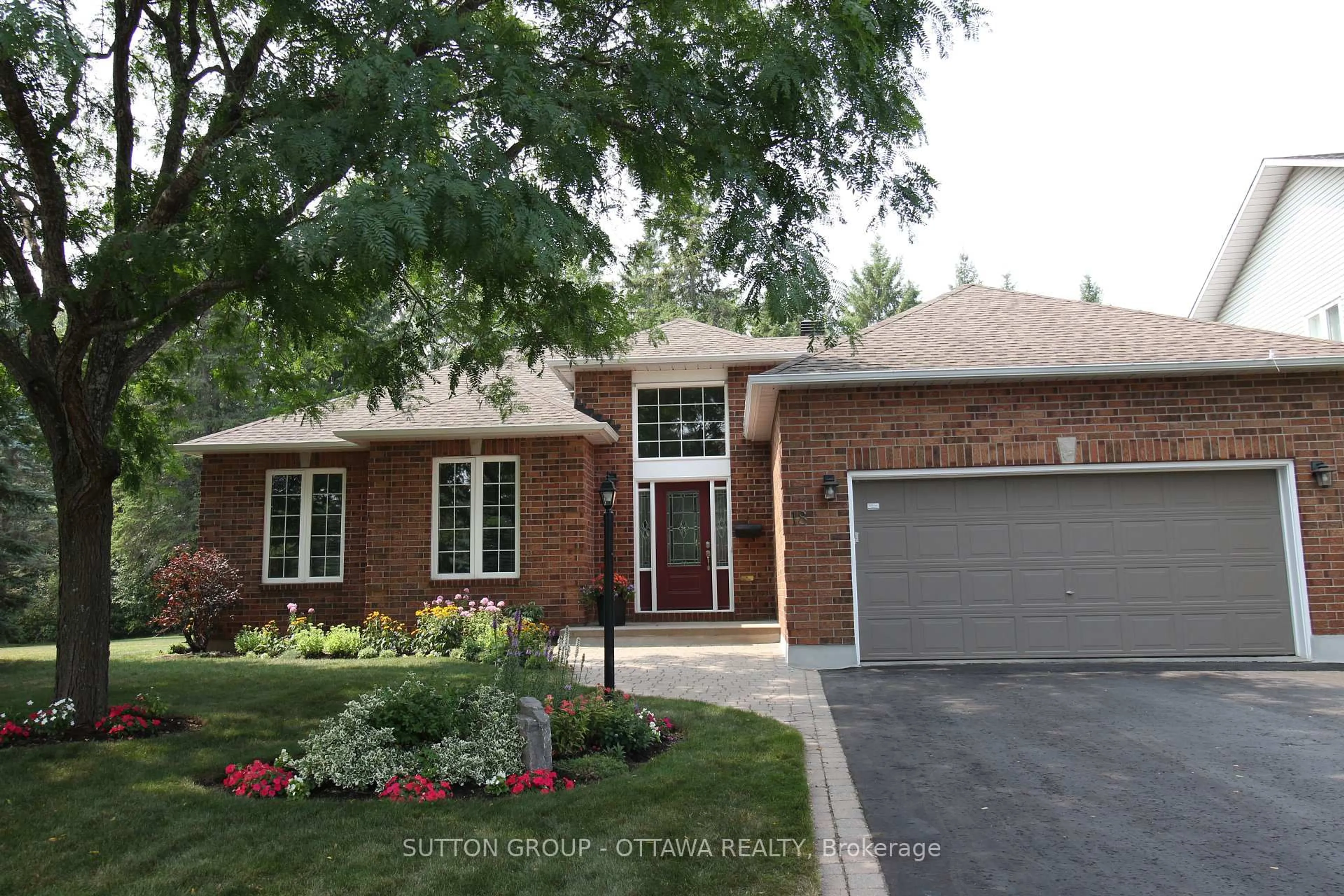 Home with brick exterior material, street for 18 Sirocco Cres, Stittsville Ontario K2S 1Z7