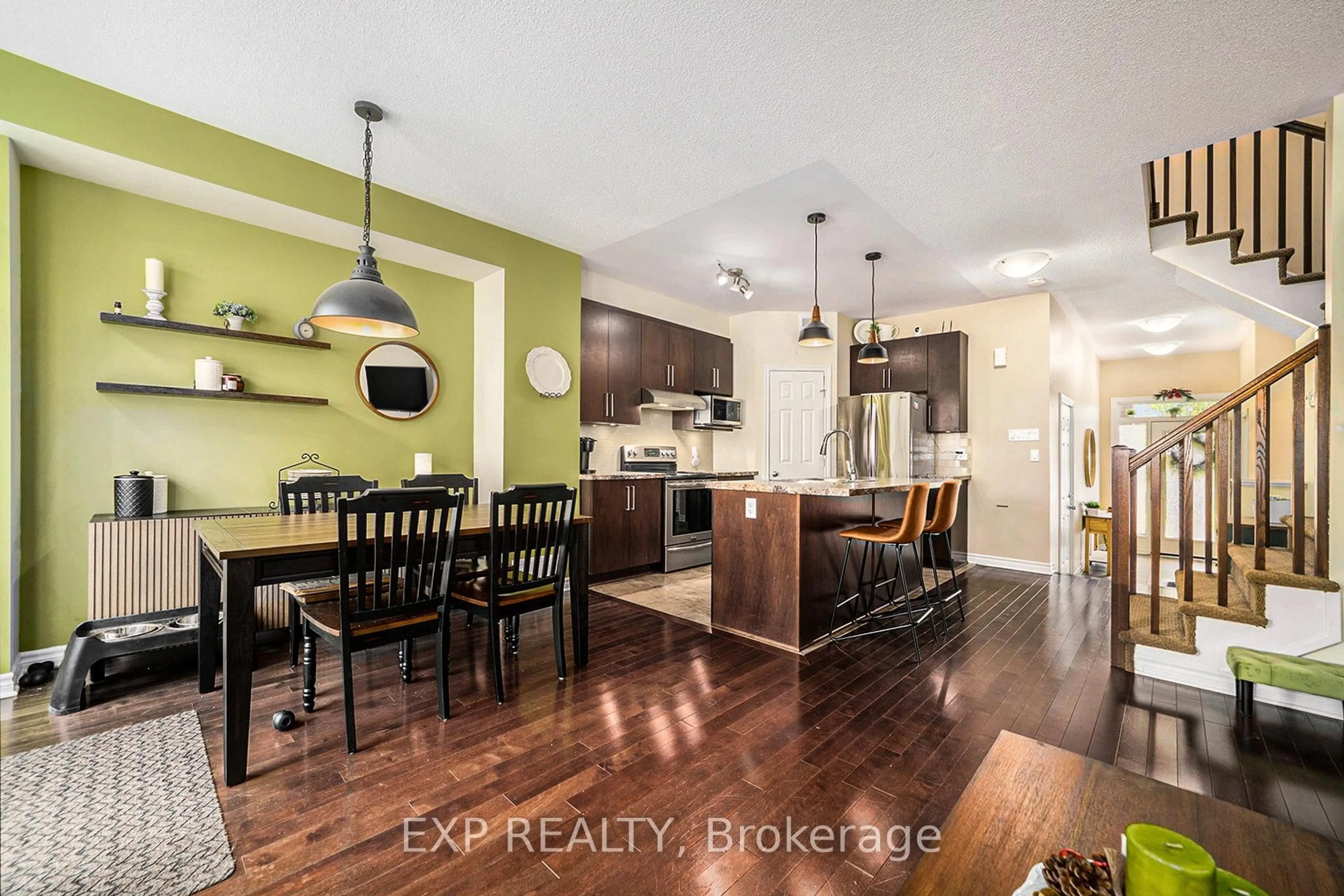 Open concept kitchen, wood/laminate floor for 203 Brambling Way, Ottawa Ontario K2J 5V5