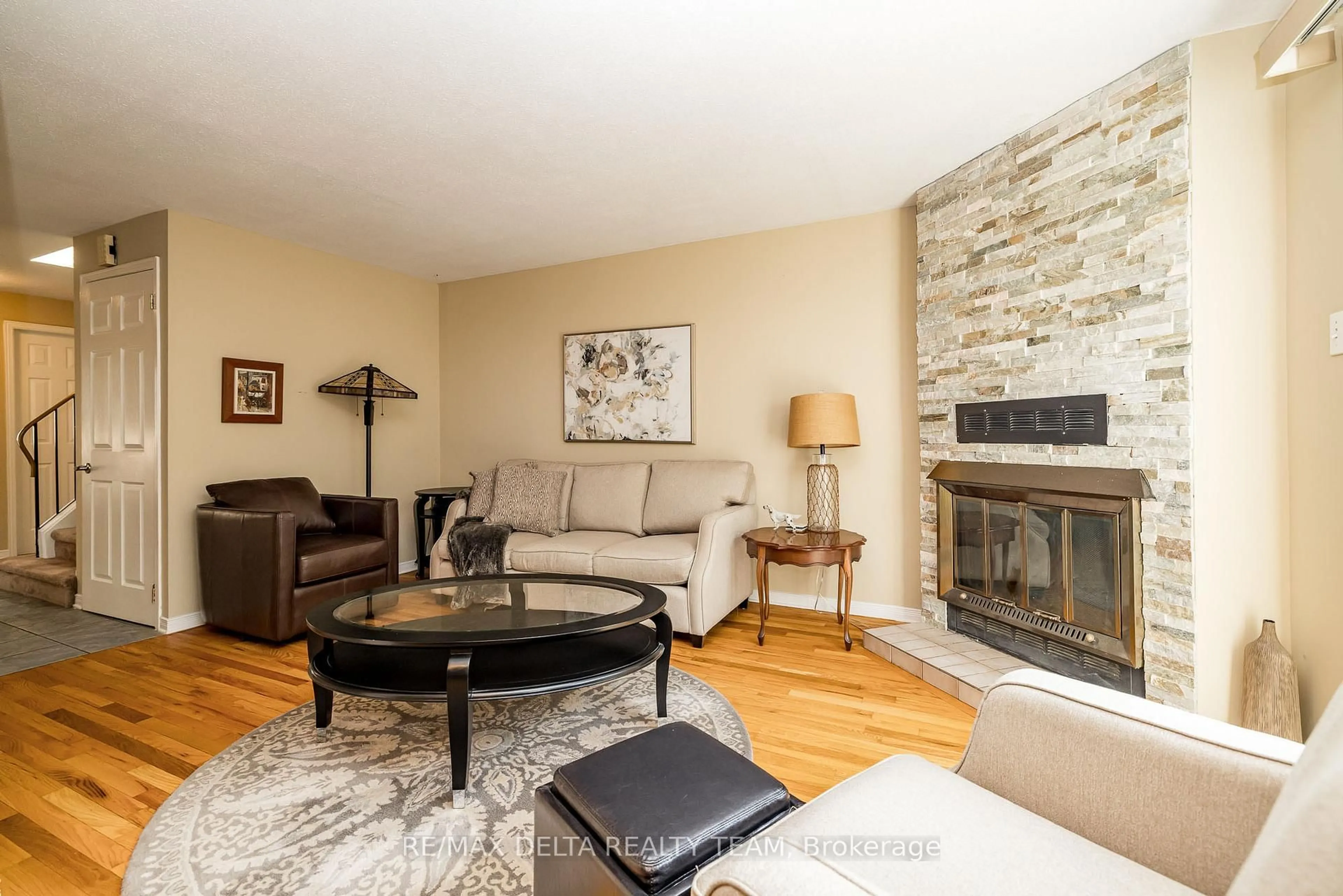 Living room with furniture, wood/laminate floor for 334 Omer-Lacasse Ave, Ottawa Ontario K1E 2X8
