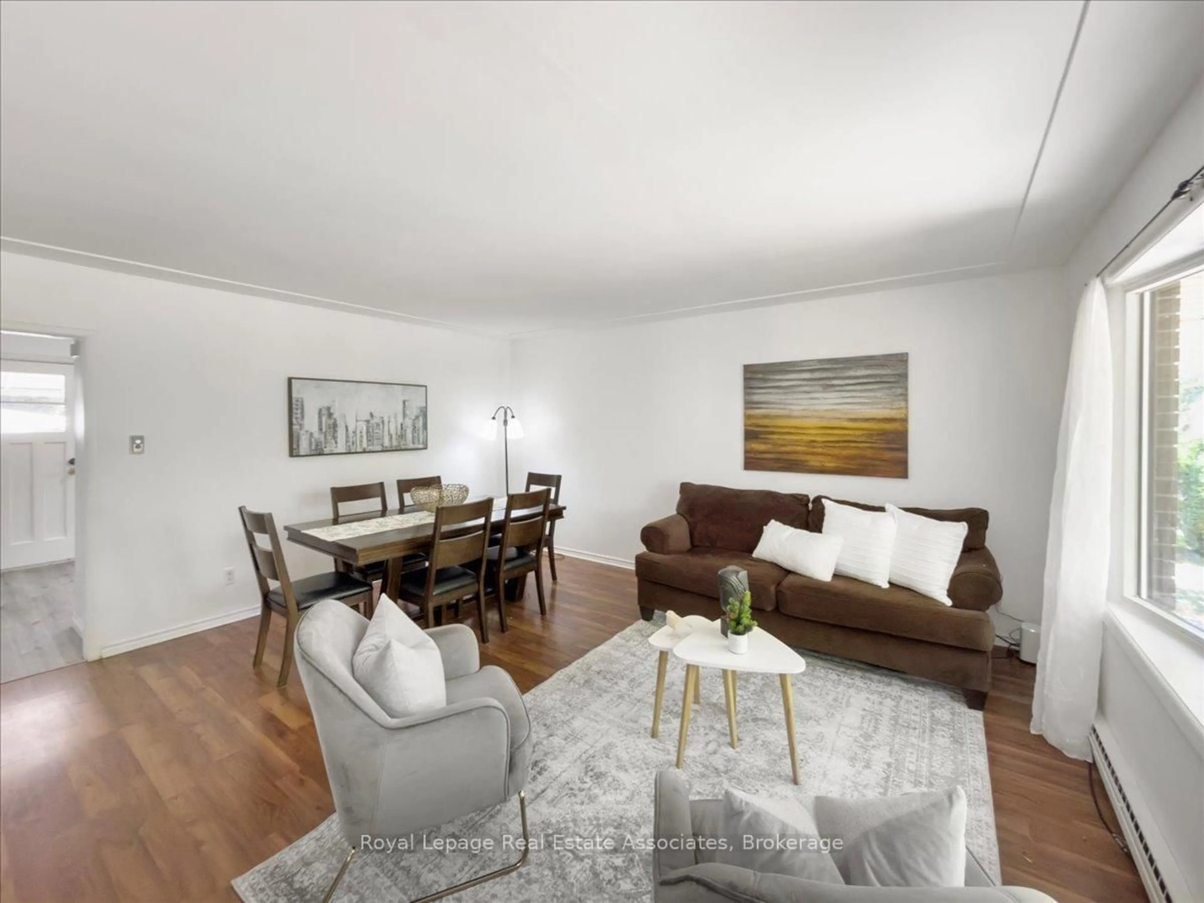 Living room with furniture, wood/laminate floor for 645 Sevilla Park Pl, London East Ontario N5Y 4H9