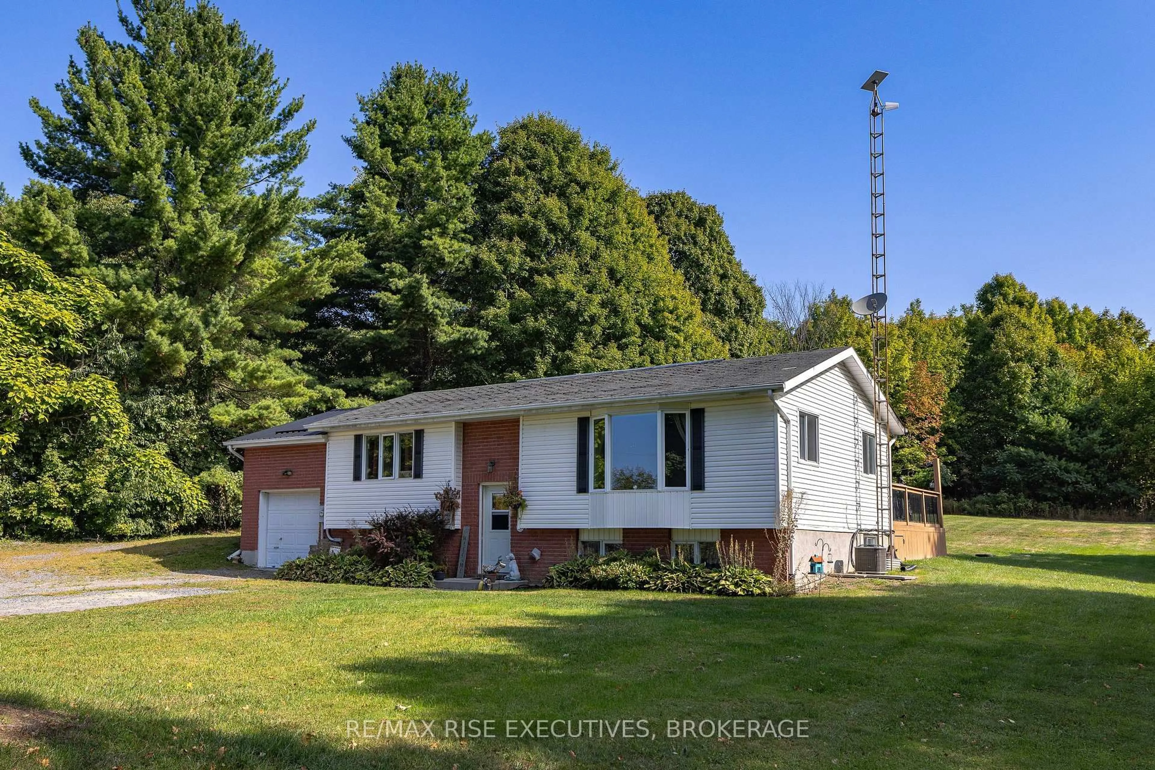 A pic from outside/outdoor area/front of a property/back of a property/a pic from drone, street for 9009 Perth Rd, Rideau Lakes Ontario K0G 1X0