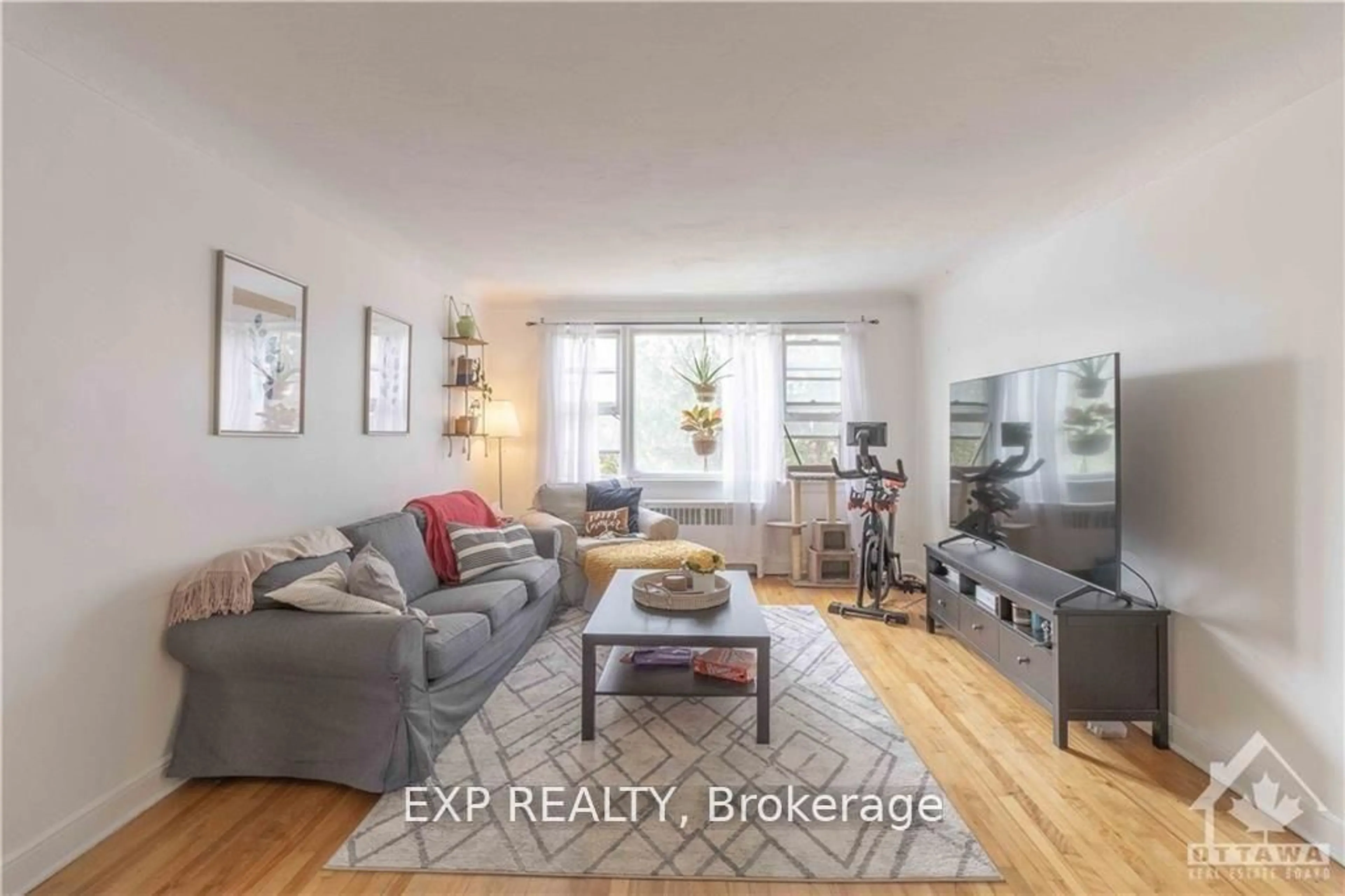 Living room with furniture, wood/laminate floor for 873 Kirkwood Ave, Ottawa Ontario K1Z 5Y3