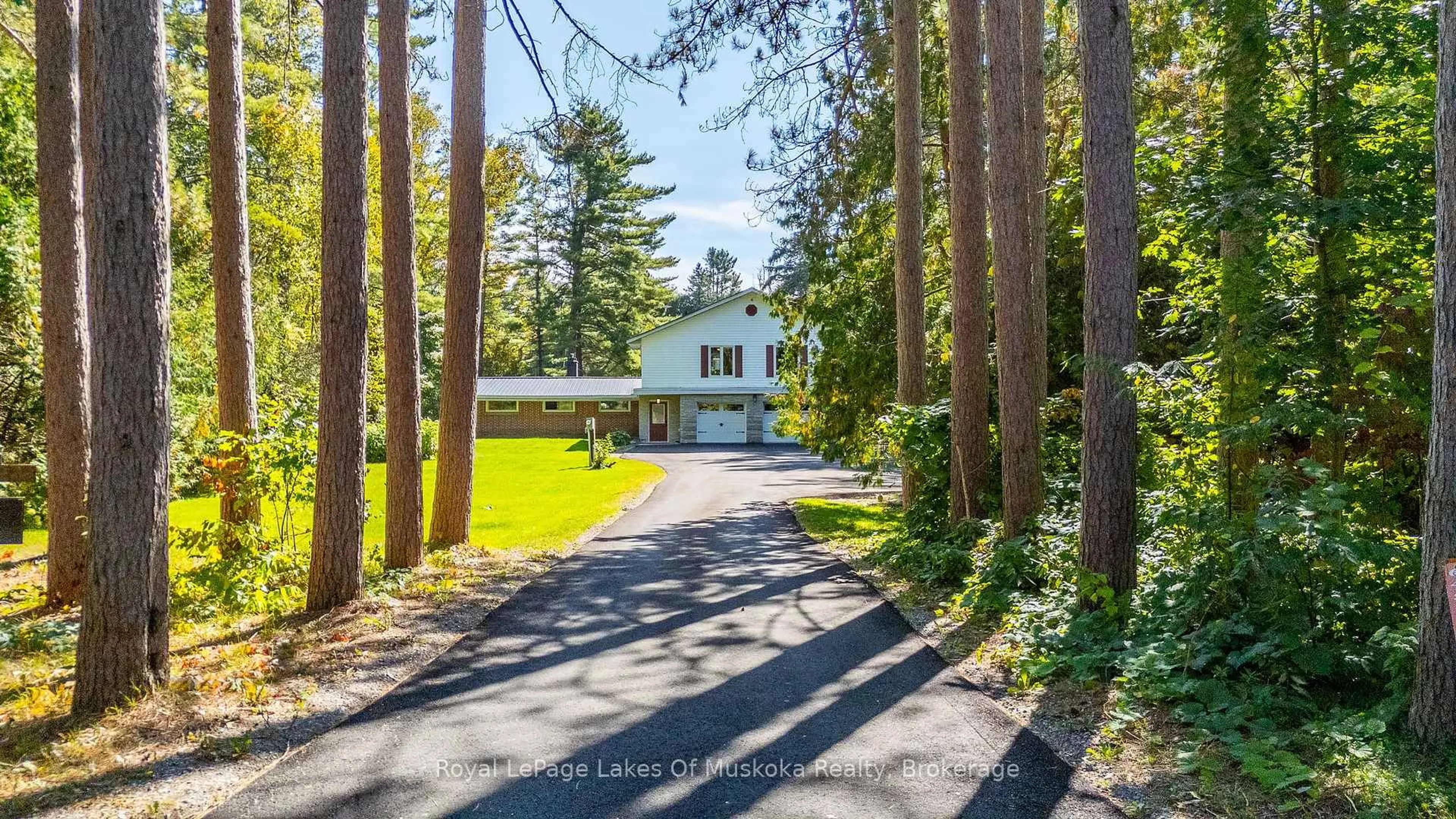 A pic from outside/outdoor area/front of a property/back of a property/a pic from drone, forest/trees view for 50 Brofoco Dr, Bracebridge Ontario P1L 1C9