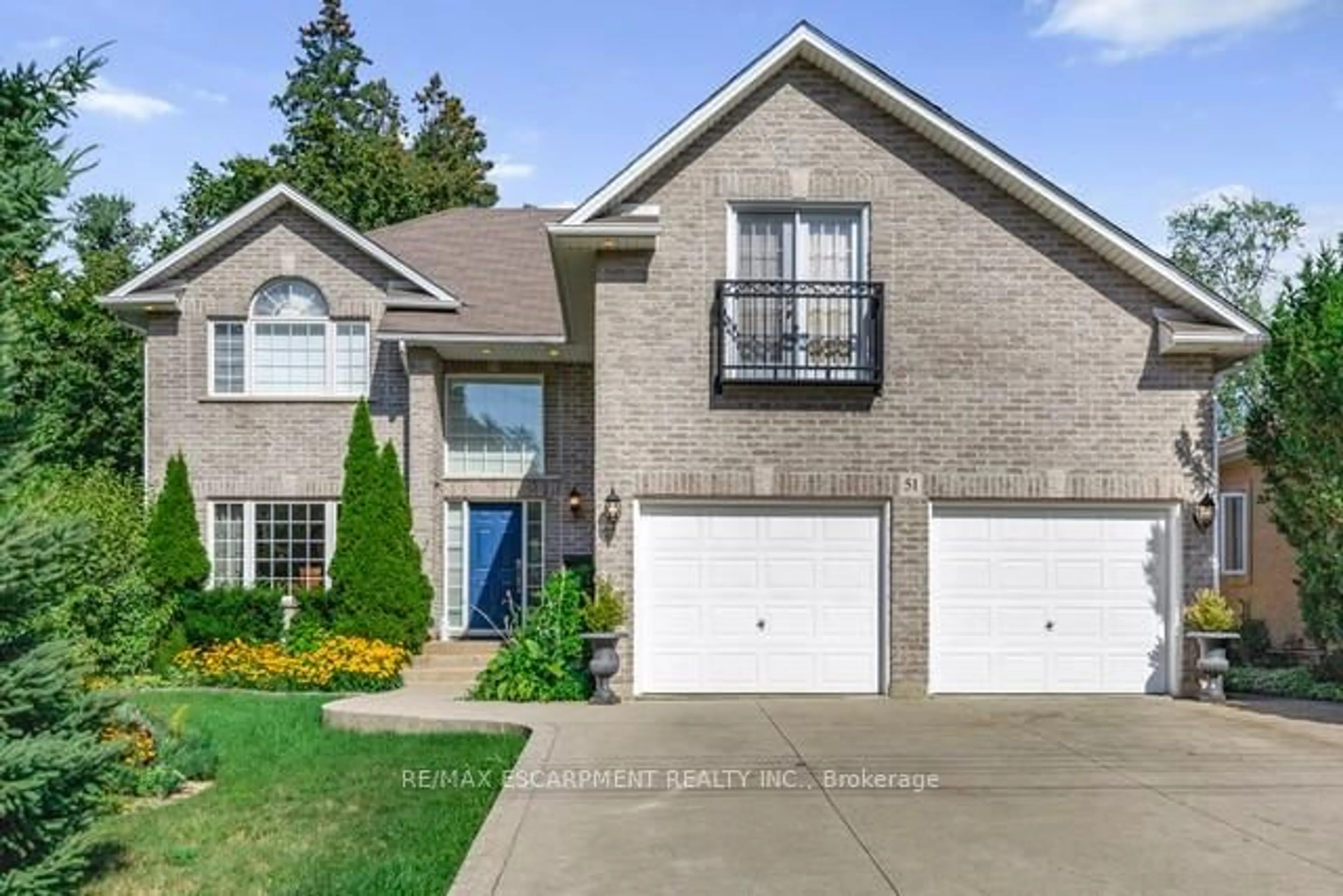 Home with brick exterior material, street for 51 Orchard Dr, Hamilton Ontario L9G 1Z6