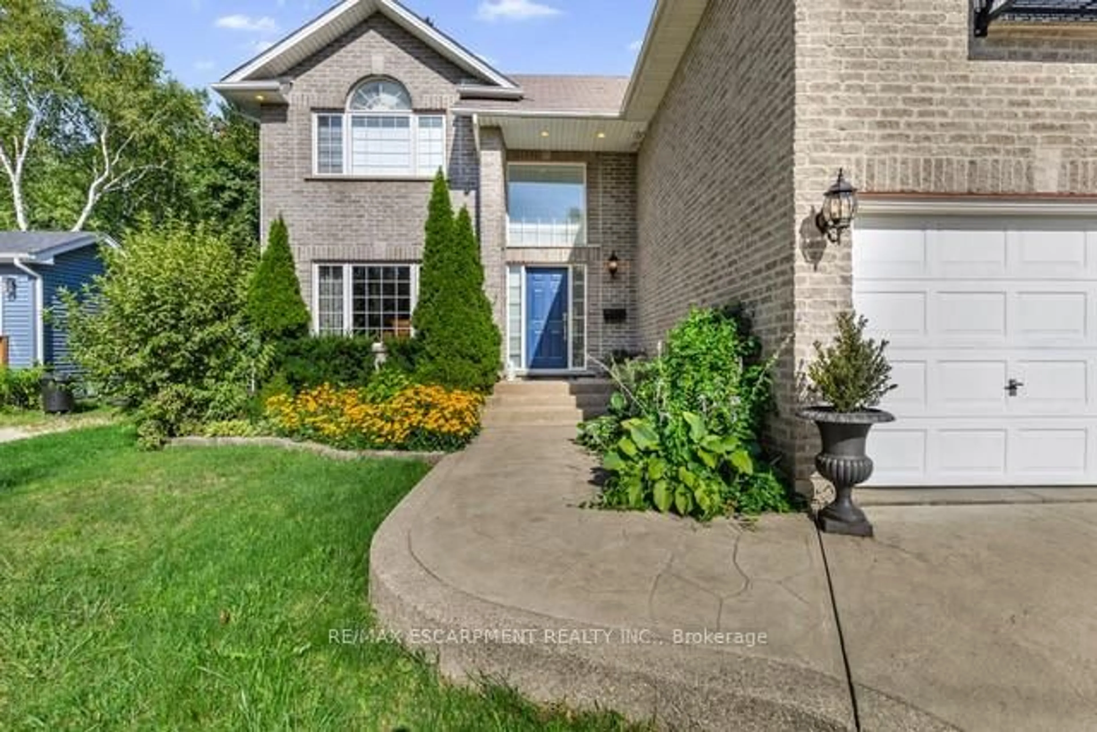 Home with brick exterior material, street for 51 Orchard Dr, Hamilton Ontario L9G 1Z6