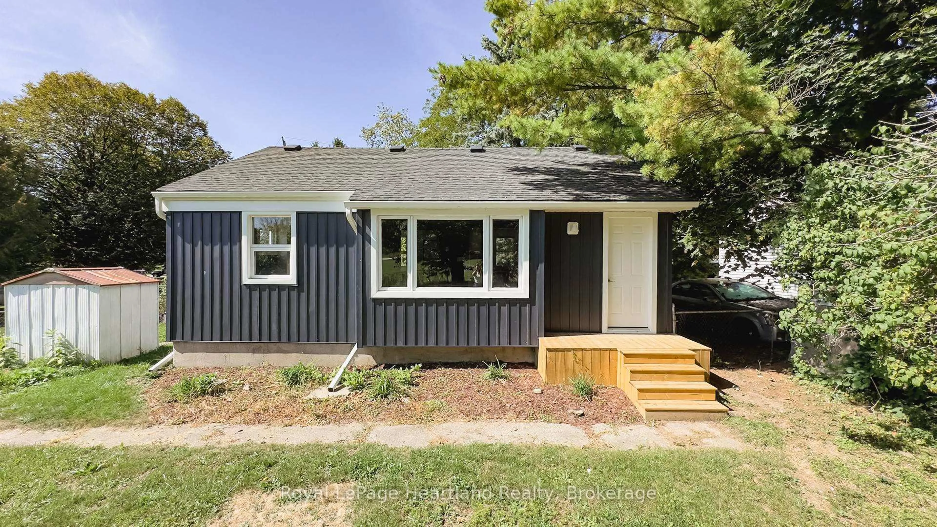 Home with vinyl exterior material, street for 26 Quebec Rd, Huron East Ontario N0M 1L0