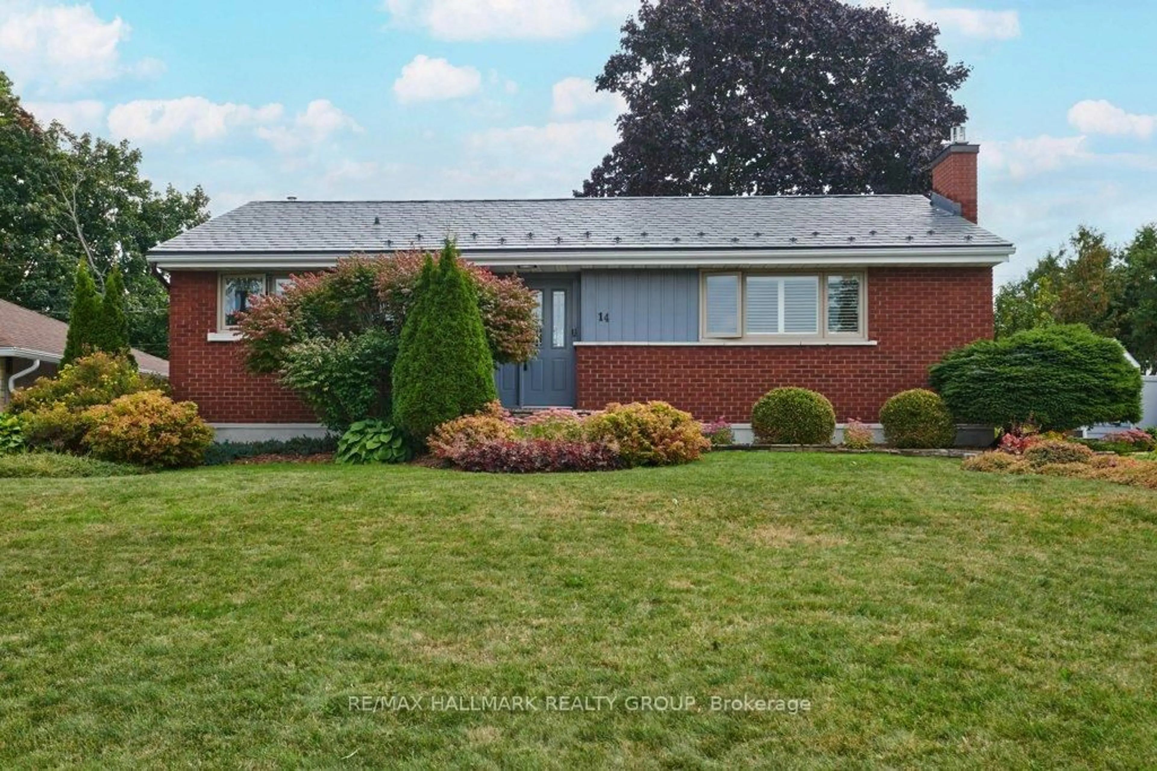 Home with brick exterior material, street for 14 Roundhay Dr, Ottawa Ontario K2G 1B5