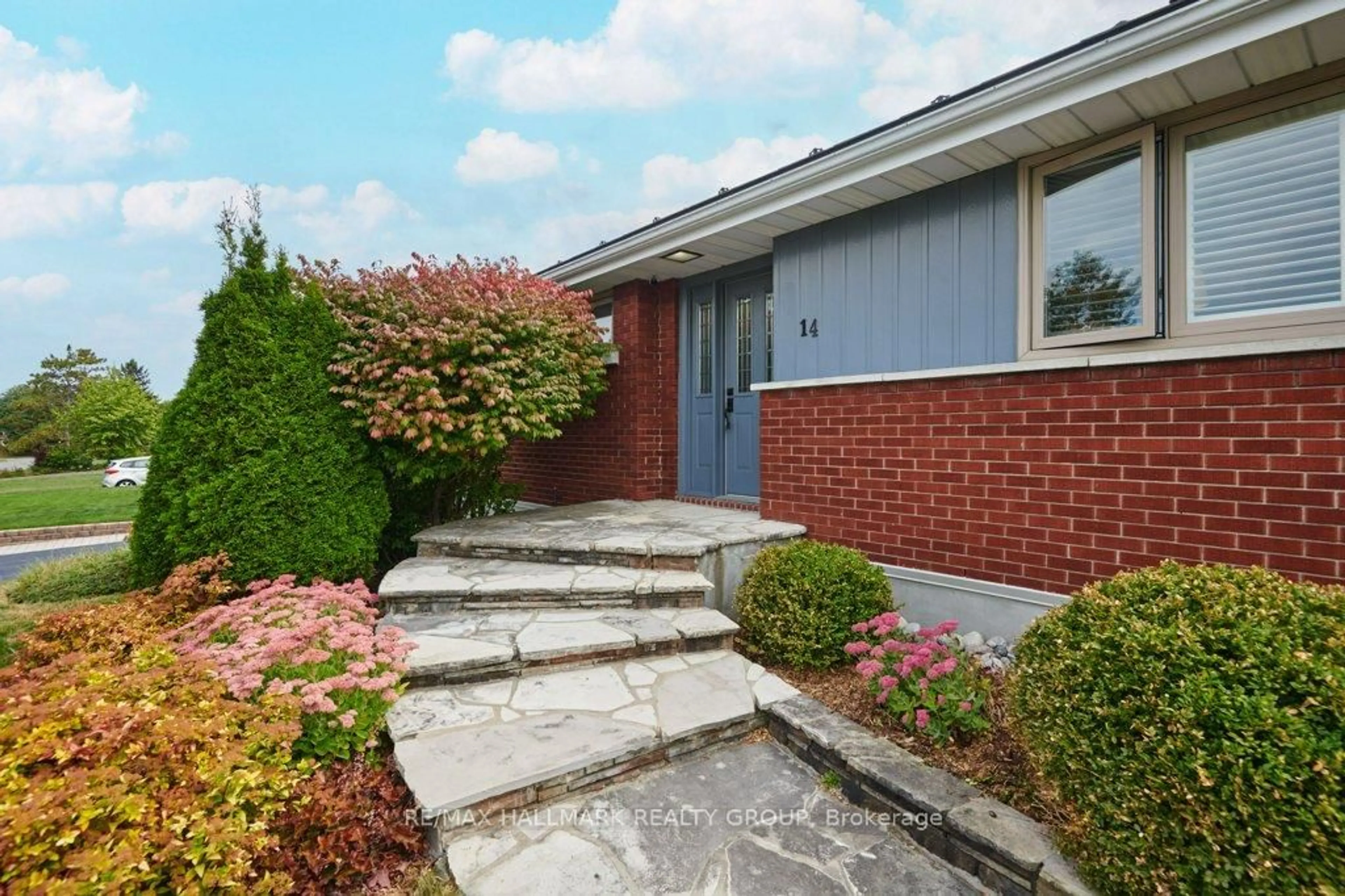 Home with brick exterior material, street for 14 Roundhay Dr, Ottawa Ontario K2G 1B5