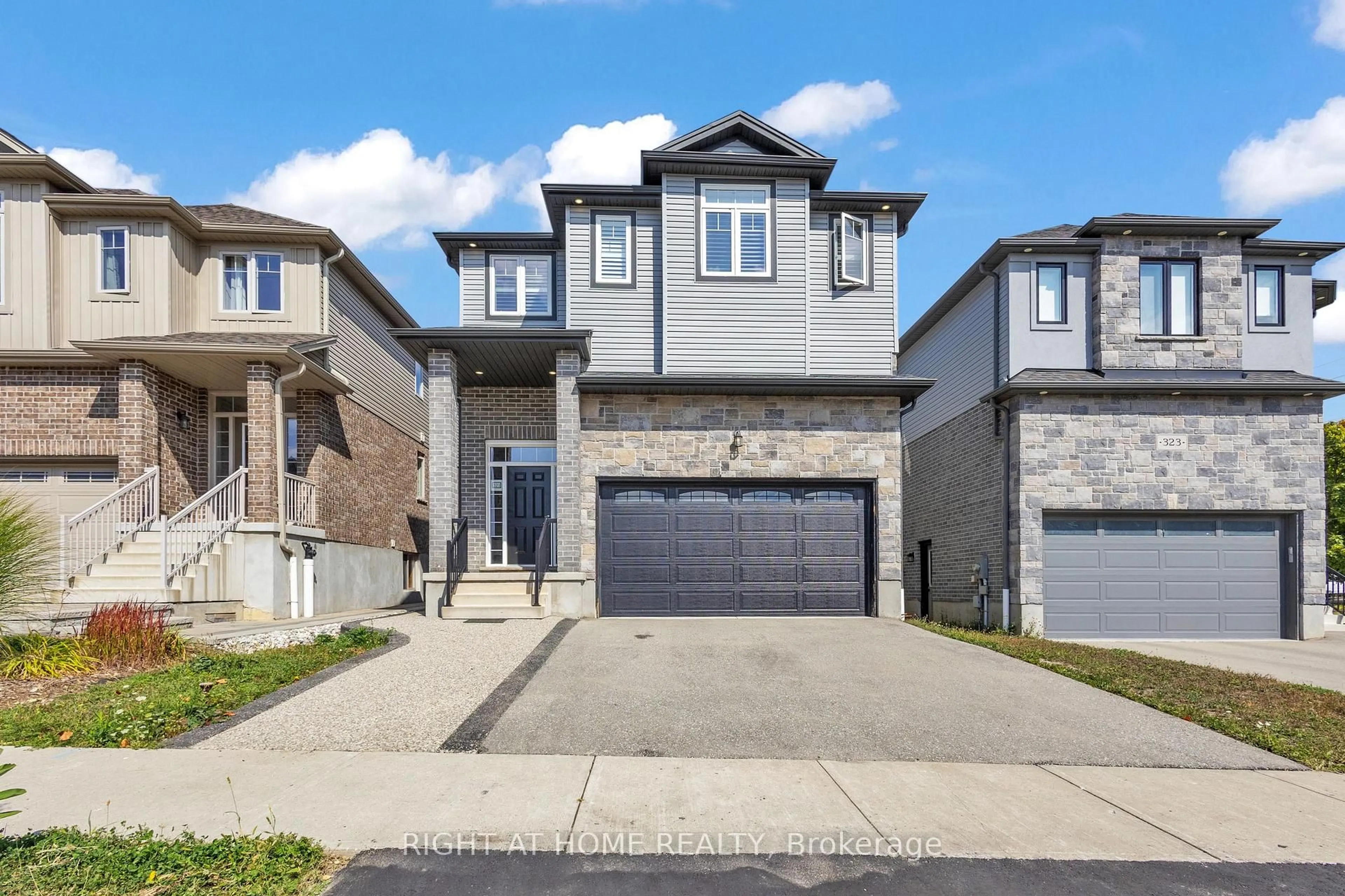 Home with brick exterior material, street for 321 Carriage Way, Waterloo Ontario N2K 0C2