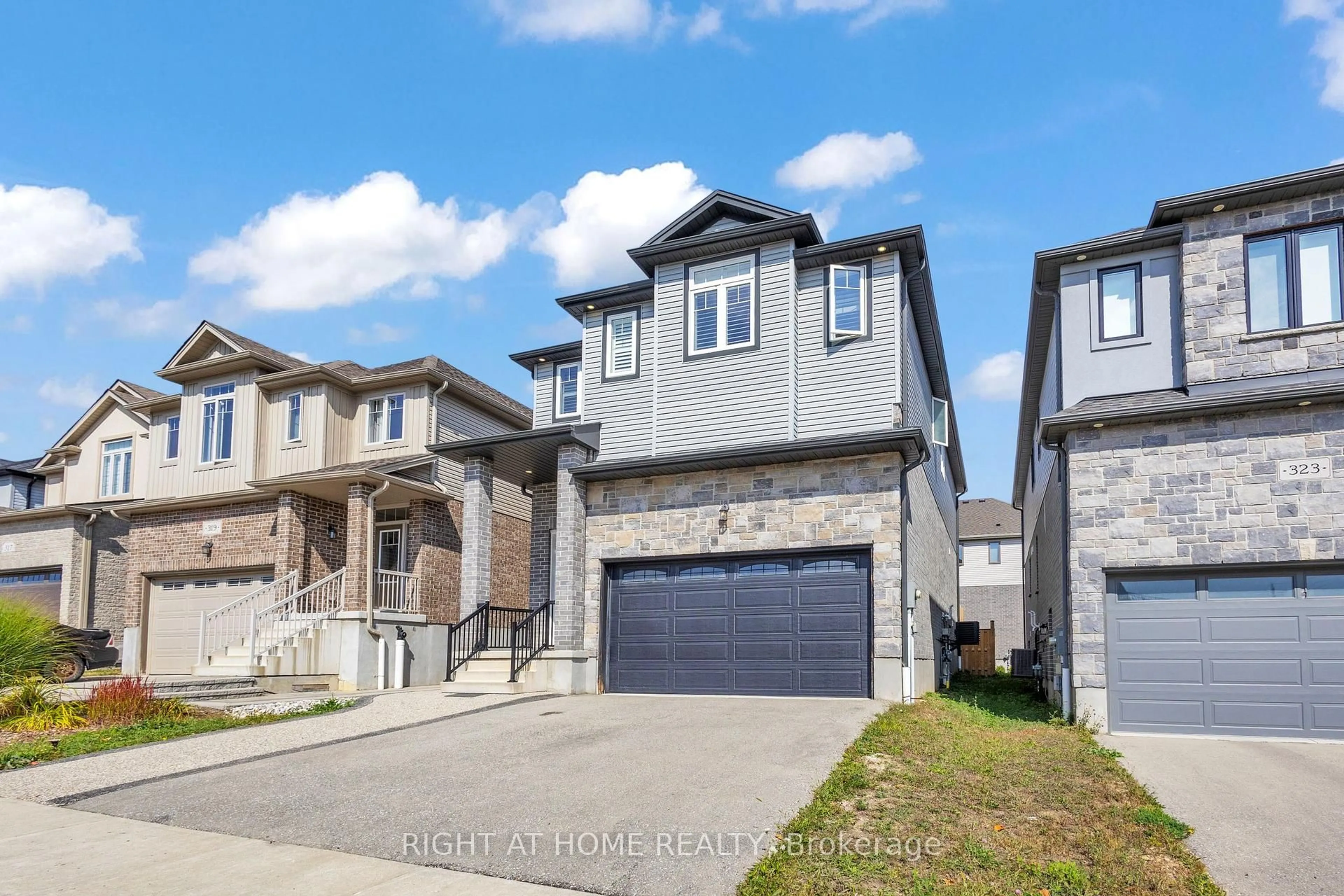 Home with brick exterior material, street for 321 Carriage Way, Waterloo Ontario N2K 0C2