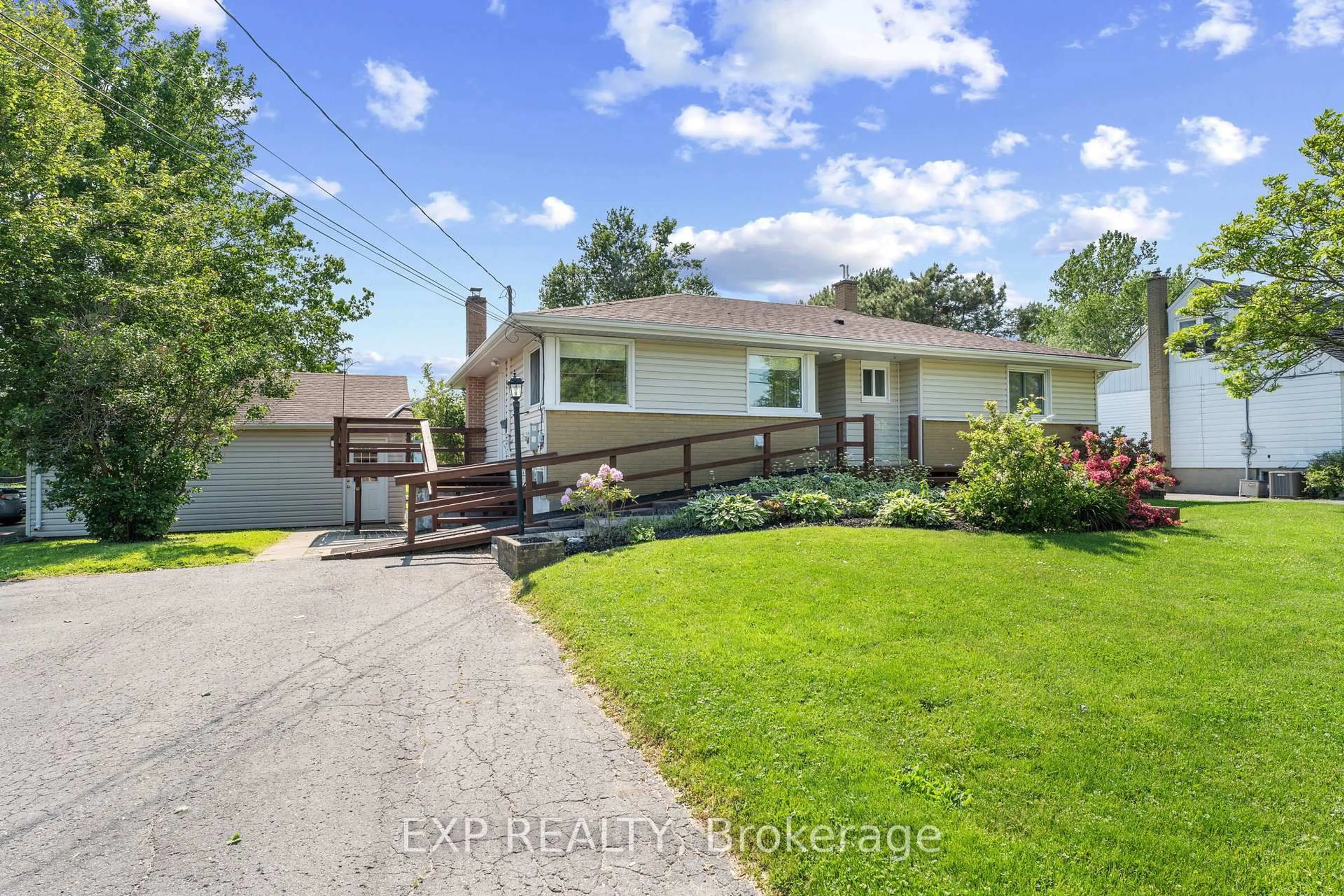 A pic from outside/outdoor area/front of a property/back of a property/a pic from drone, street for 450 Coronation Blvd, Amherstview Ontario K7M 5P9