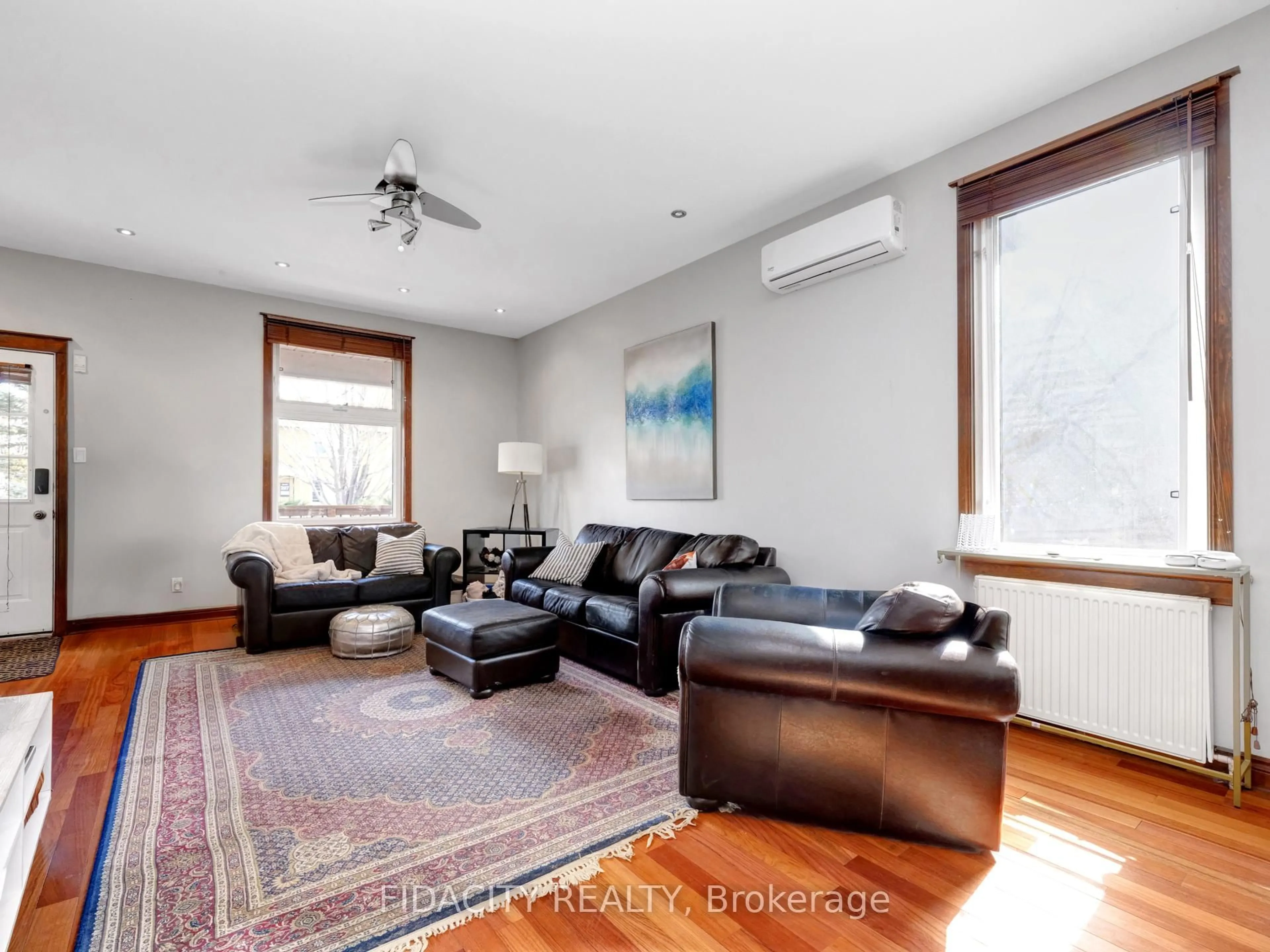 Living room with furniture, wood/laminate floor for 296 Royal Ave, Ottawa Ontario K2A 1T5