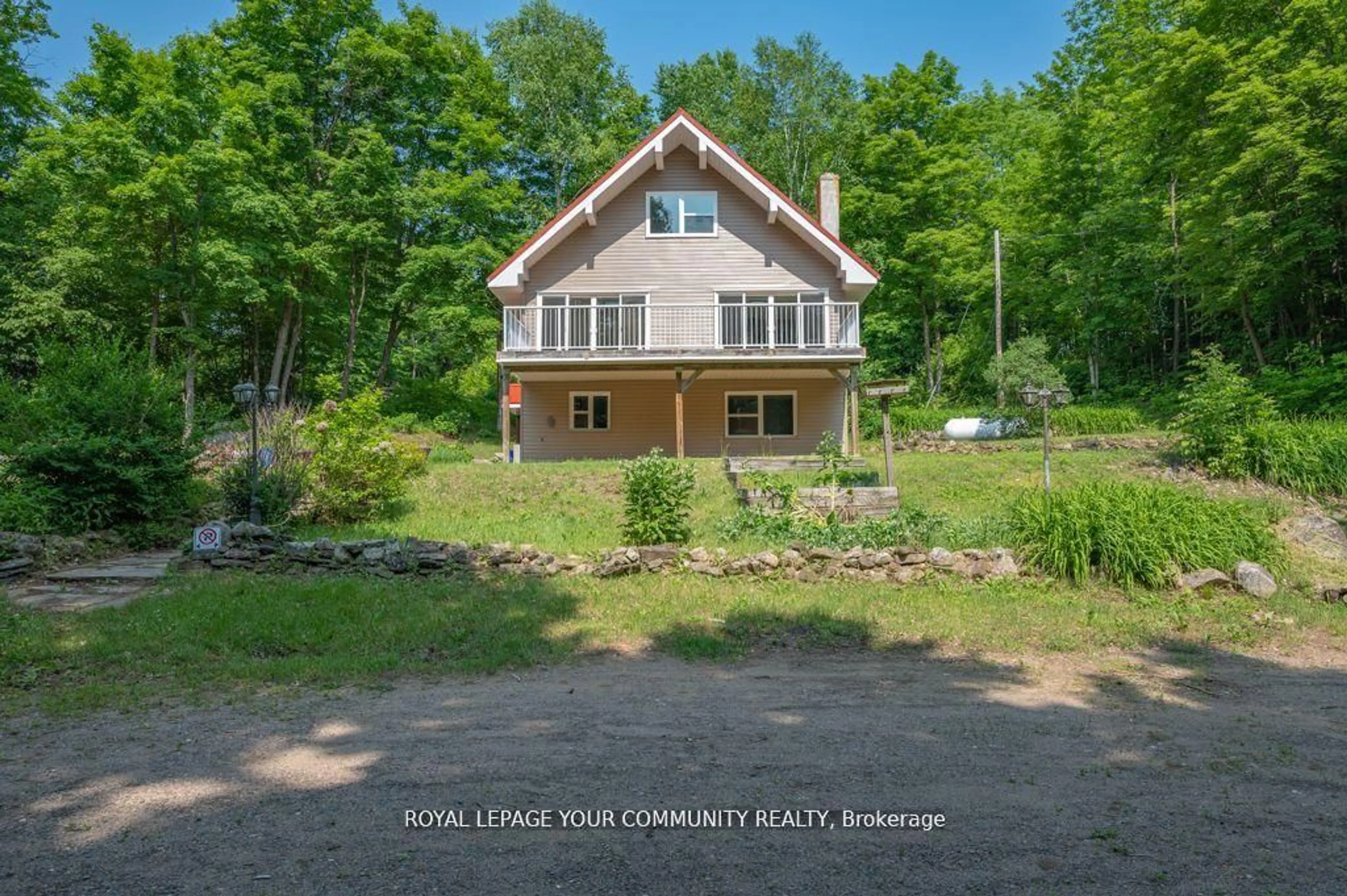 A pic from outside/outdoor area/front of a property/back of a property/a pic from drone, water/lake/river/ocean view for 9297 Highway 118, Minden Hills Ontario K0M 1J2