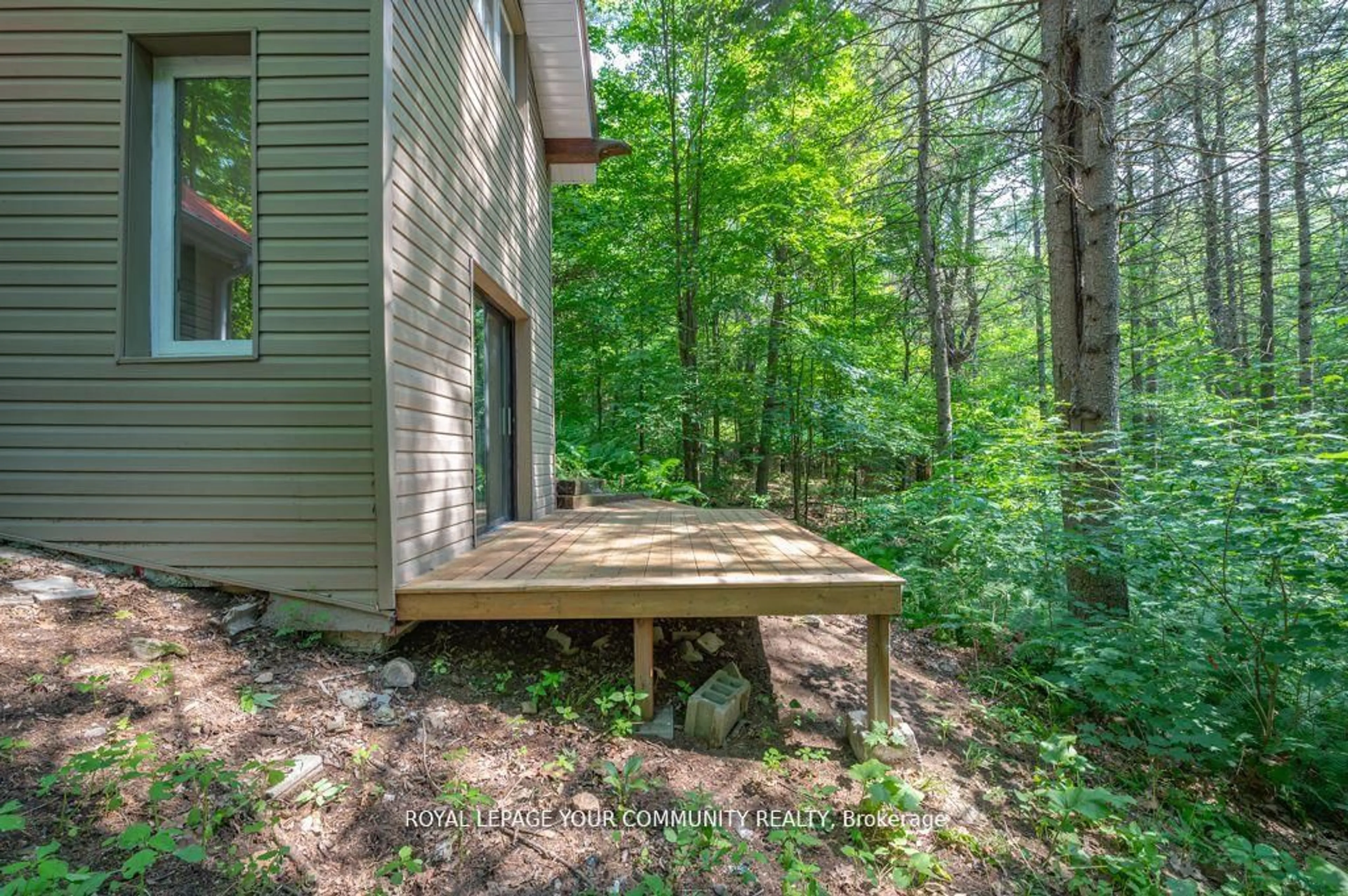 Patio, forest/trees view for 9297 Highway 118, Minden Hills Ontario K0M 1J2