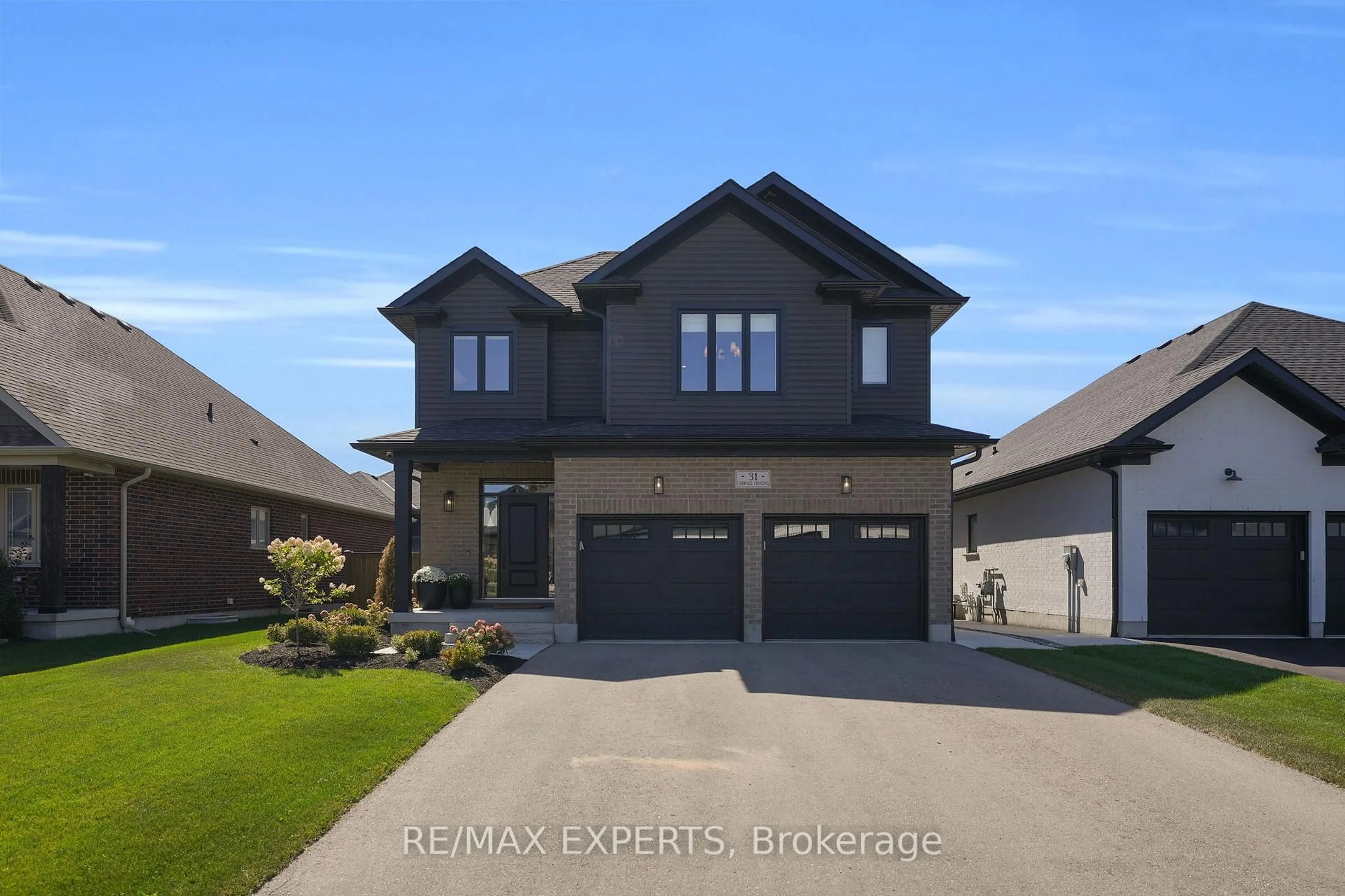 Home with brick exterior material, street for 31 Carriage Crossing, Mapleton Ontario N0G 1P0