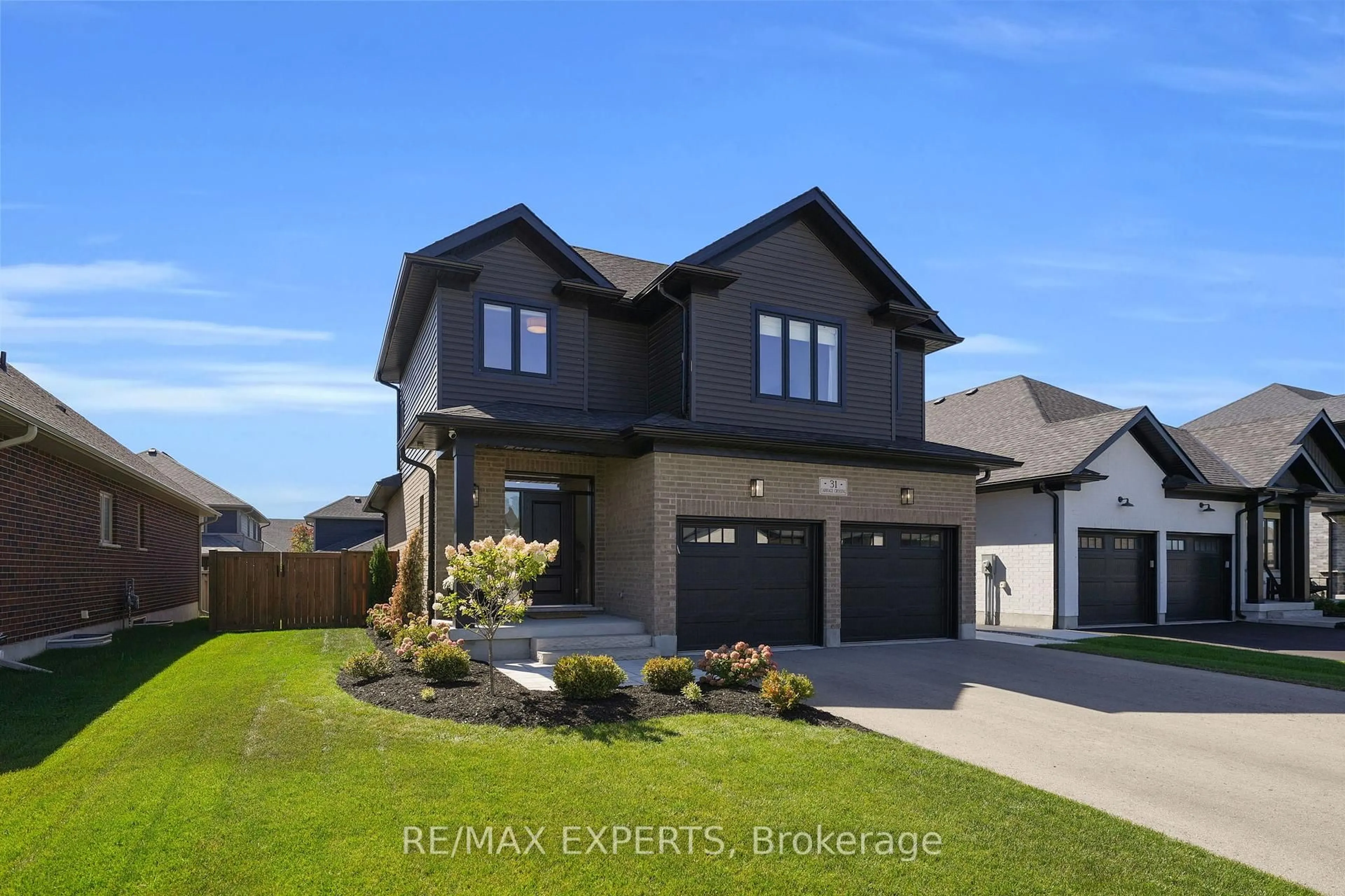 Home with brick exterior material, street for 31 Carriage Crossing, Mapleton Ontario N0G 1P0