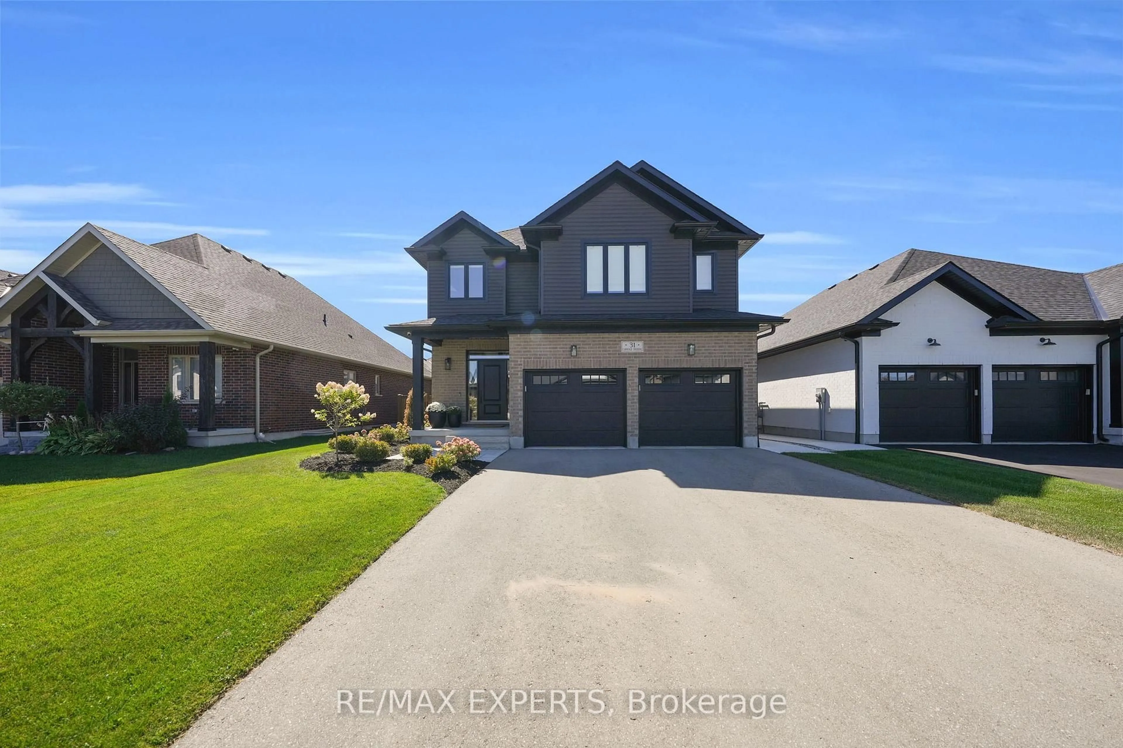 Home with brick exterior material, street for 31 Carriage Crossing, Mapleton Ontario N0G 1P0