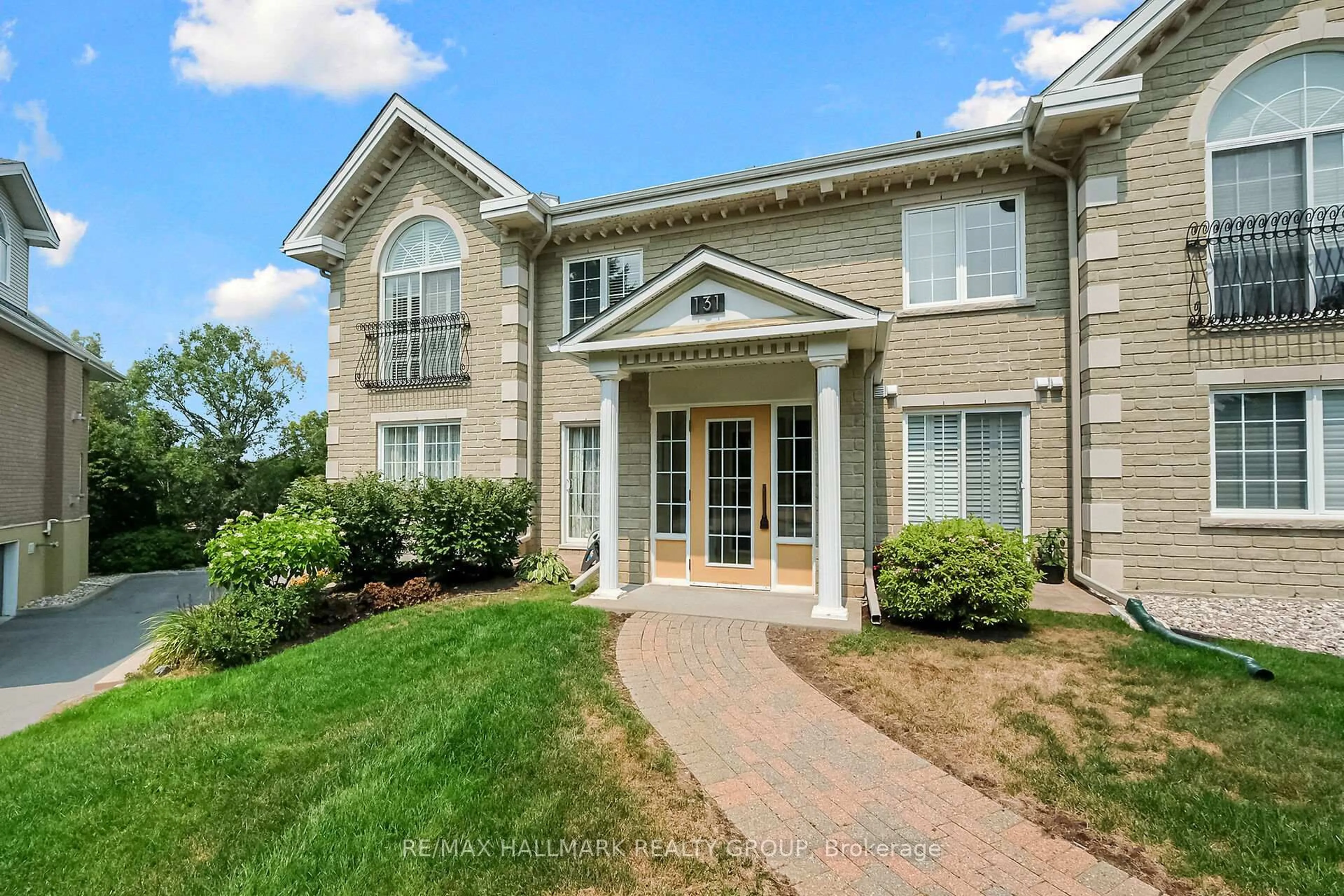 Home with brick exterior material, street for 131 Robson Crt #1A, Ottawa Ontario K2K 2W1