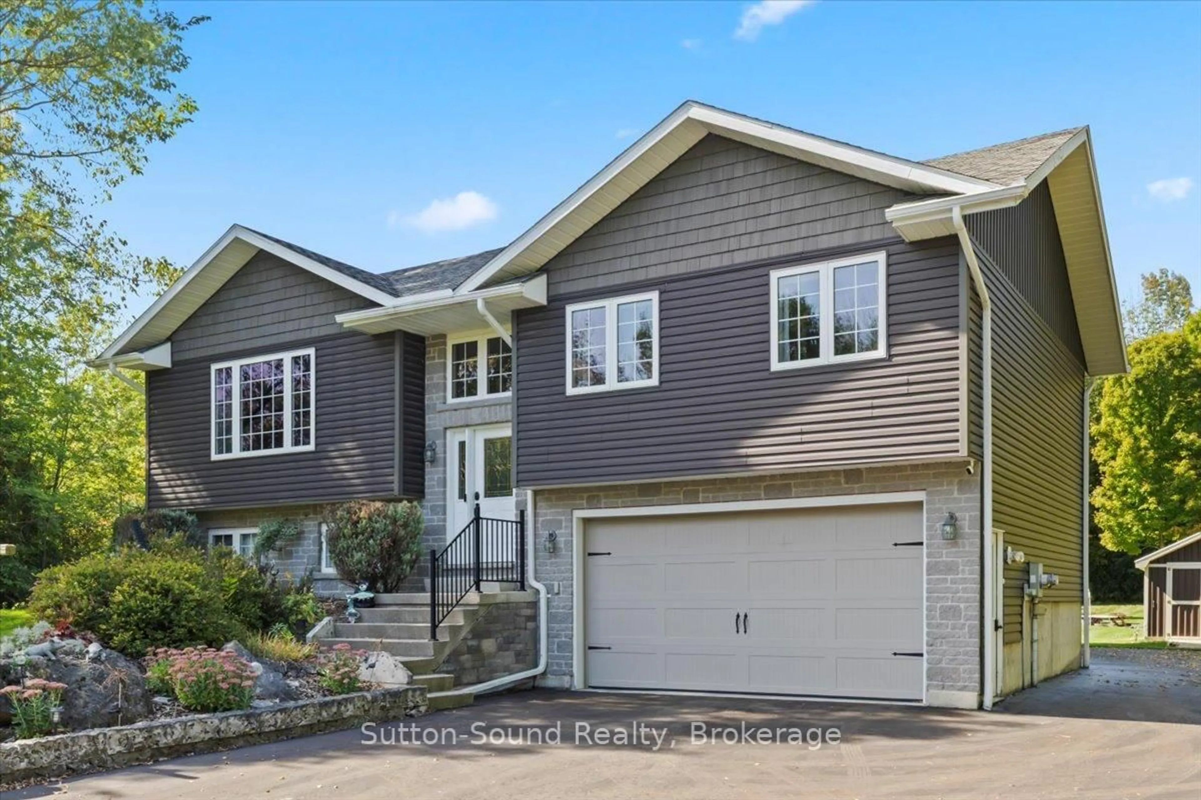 Home with vinyl exterior material, street for 240067 Wilcox Sdrd, Georgian Bluffs Ontario N4K 5N7