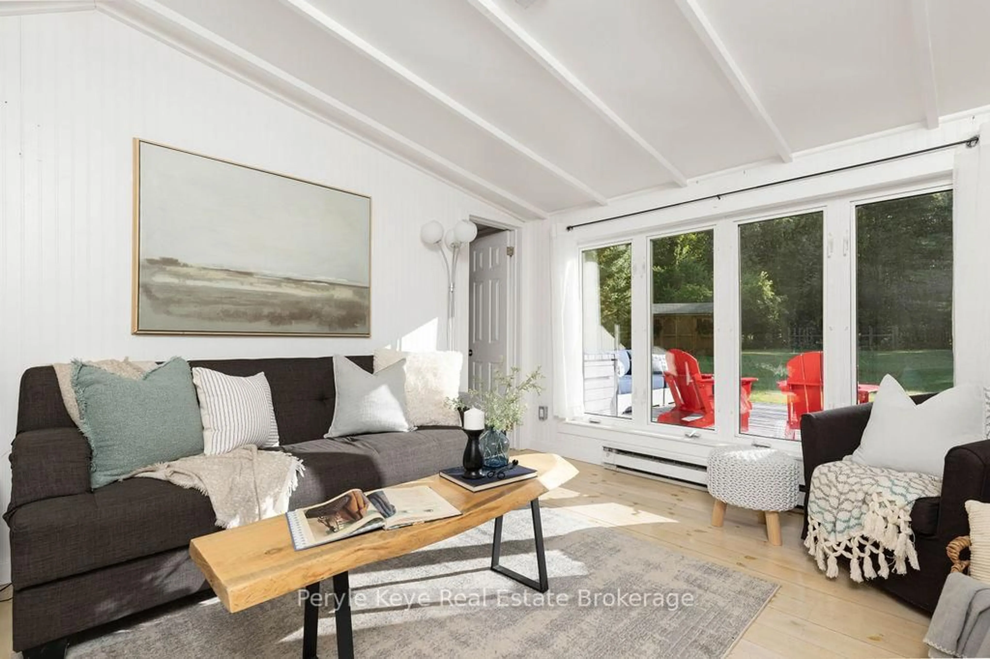 Living room with furniture, wood/laminate floor for 71 Deer Lake Rd, Huntsville Ontario P0B 1L0
