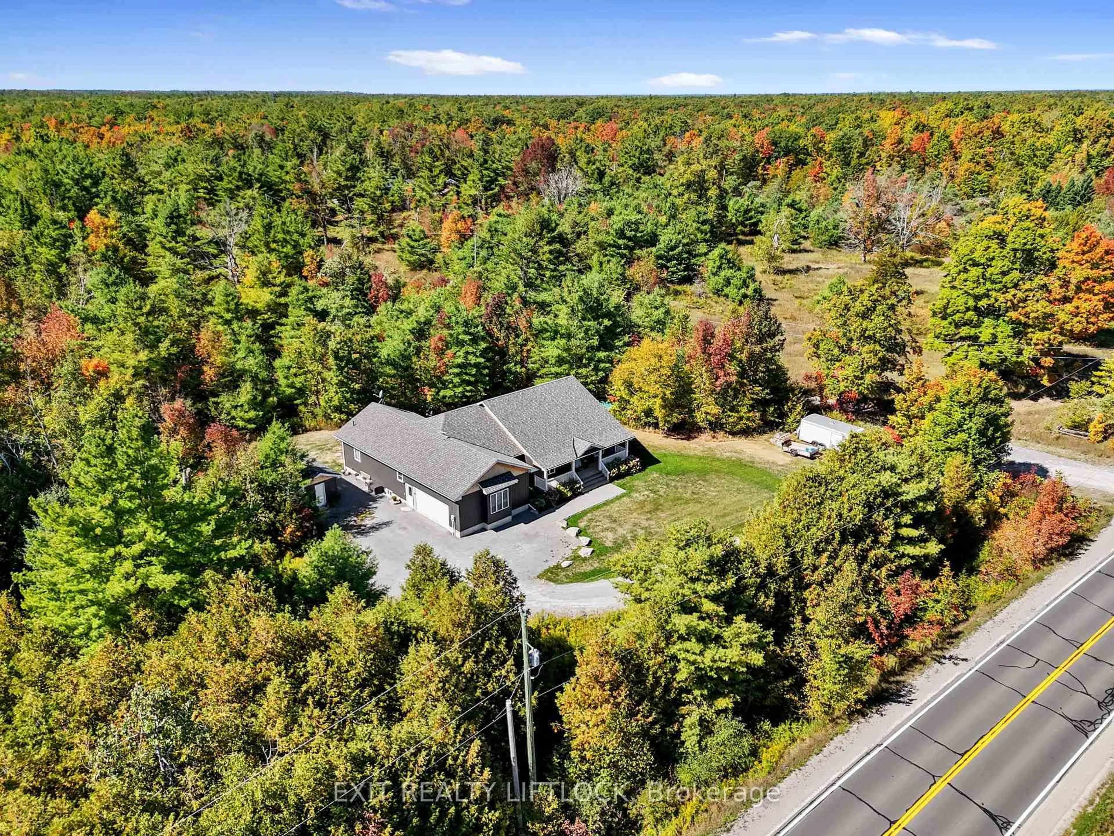 A pic from outside/outdoor area/front of a property/back of a property/a pic from drone, forest/trees view for 1658 County Road 40, Douro-Dummer Ontario K0L 2V0