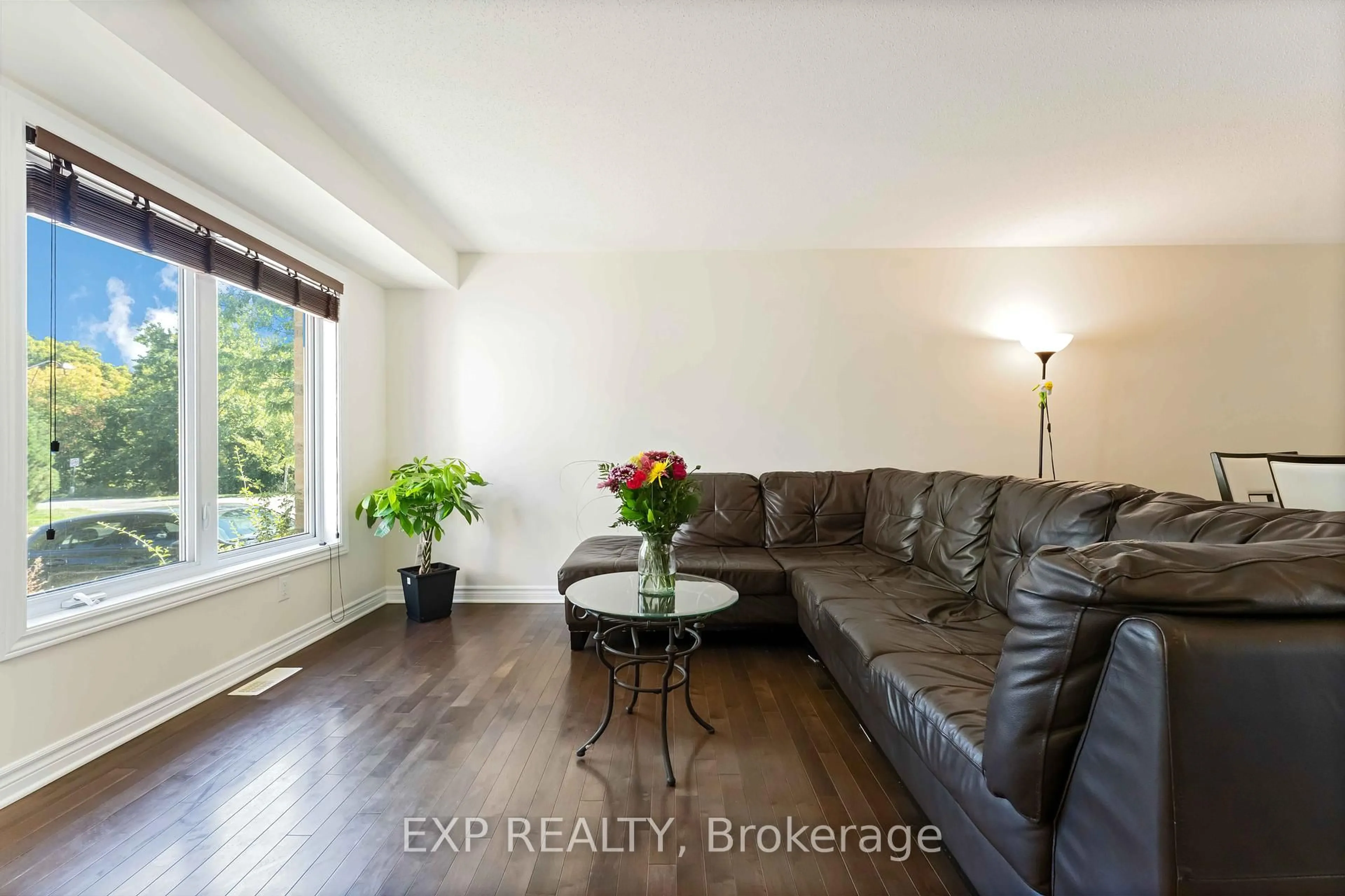 Living room with furniture, wood/laminate floor for 205 Temagami Dr, Barrhaven Ontario K2J 0X7