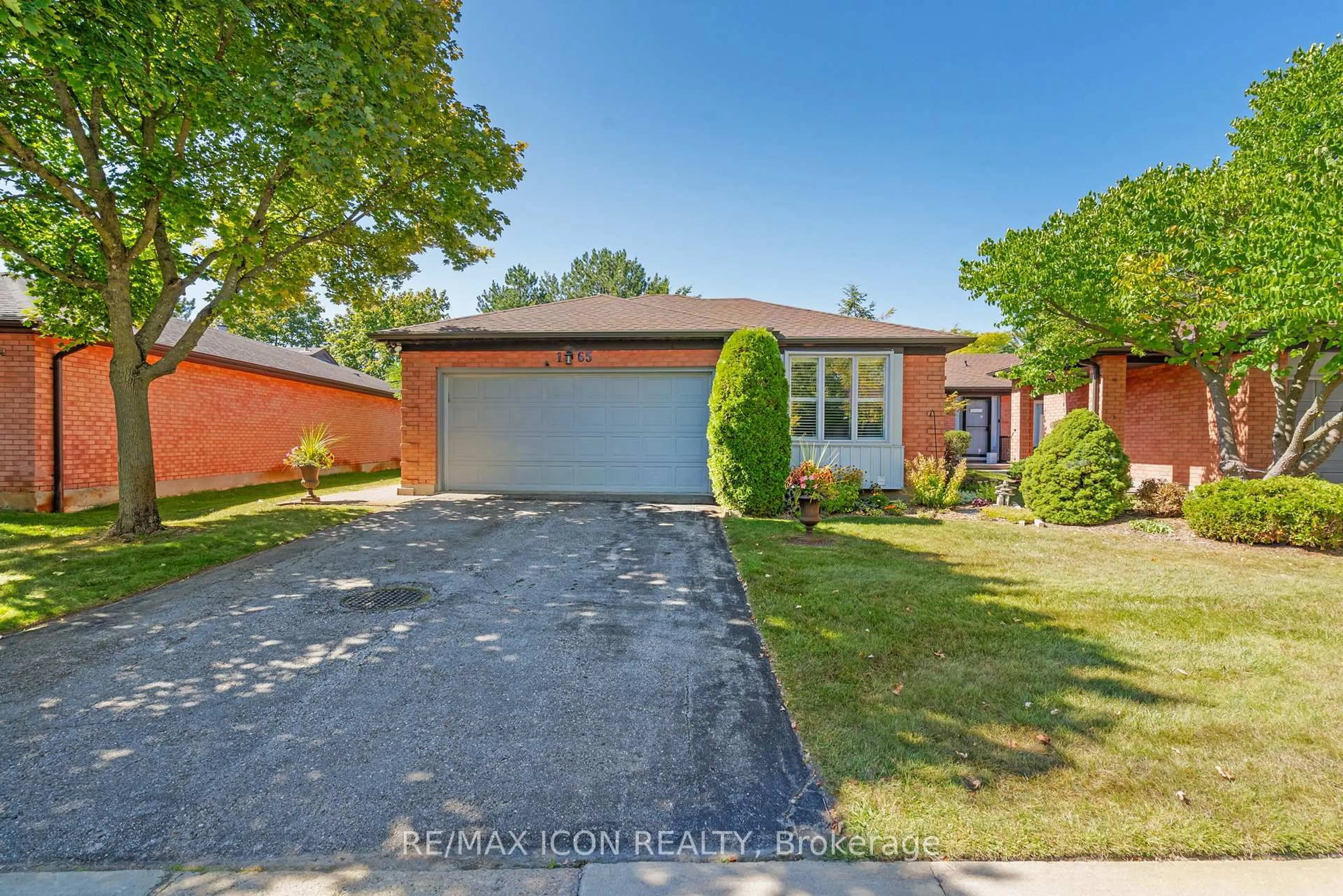 A pic from outside/outdoor area/front of a property/back of a property/a pic from drone, street for 65 Fiddlers Green Rd #1, London North Ontario N6H 4V5