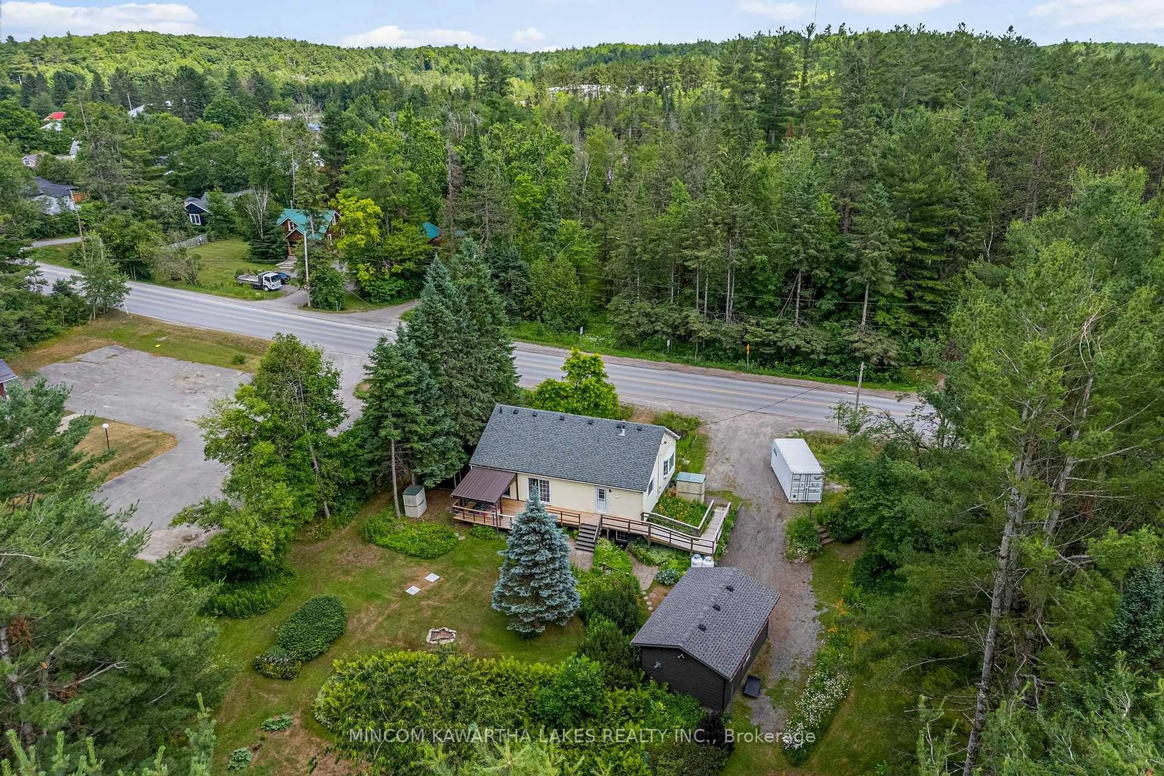A pic from outside/outdoor area/front of a property/back of a property/a pic from drone, forest/trees view for 60 Burleigh St, North Kawartha Ontario K0L 1A0