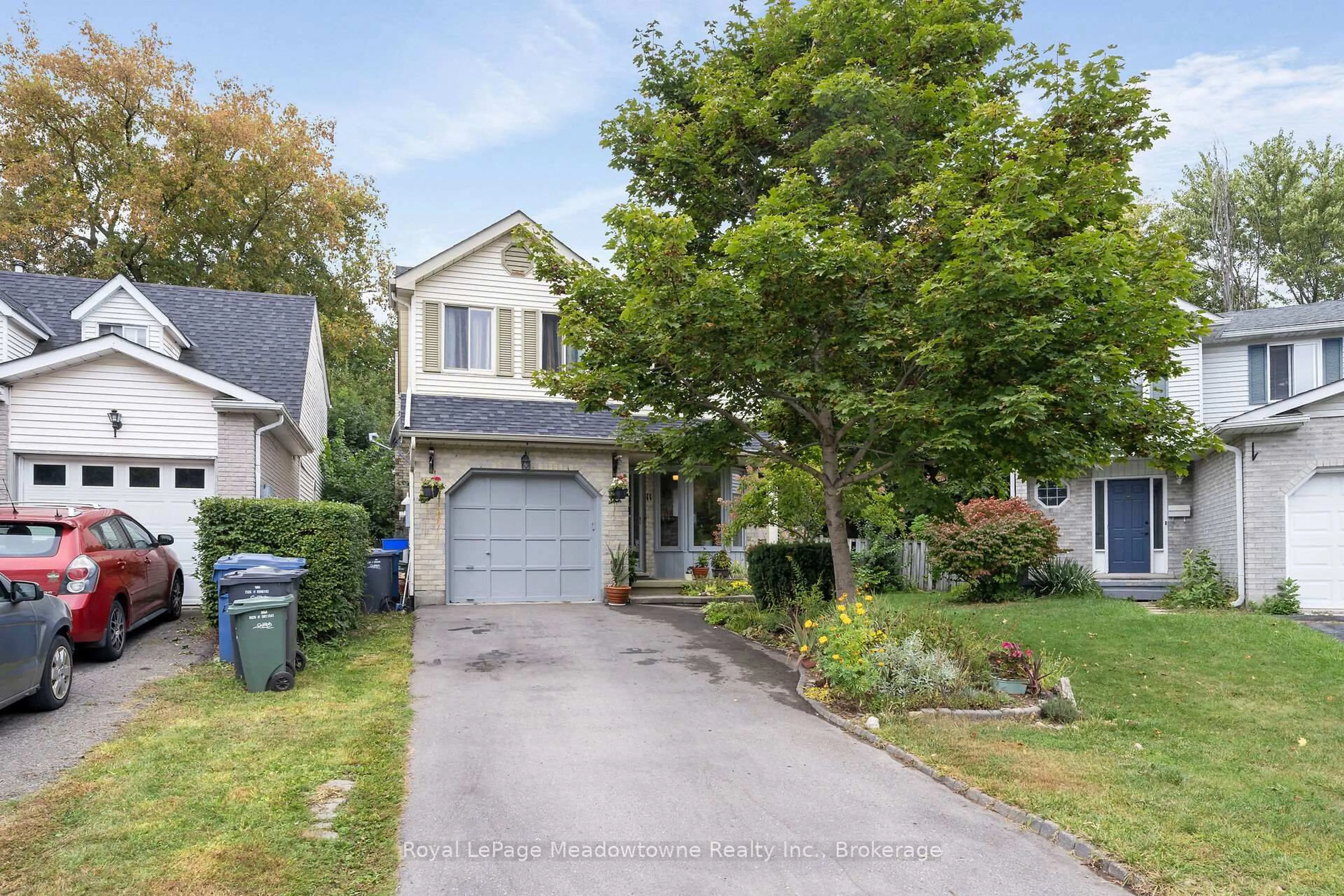 Home with vinyl exterior material, street for 11 Valeriote Pl, Guelph Ontario N1G 3X1