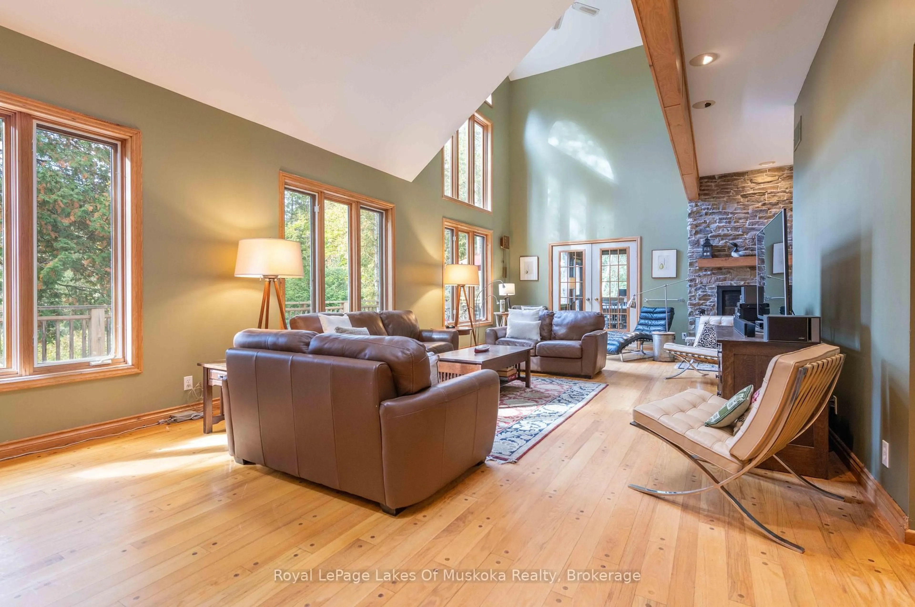 Living room with furniture, wood/laminate floor for 597 Echo Ridge Rd, Kearney Ontario P0A 1M0