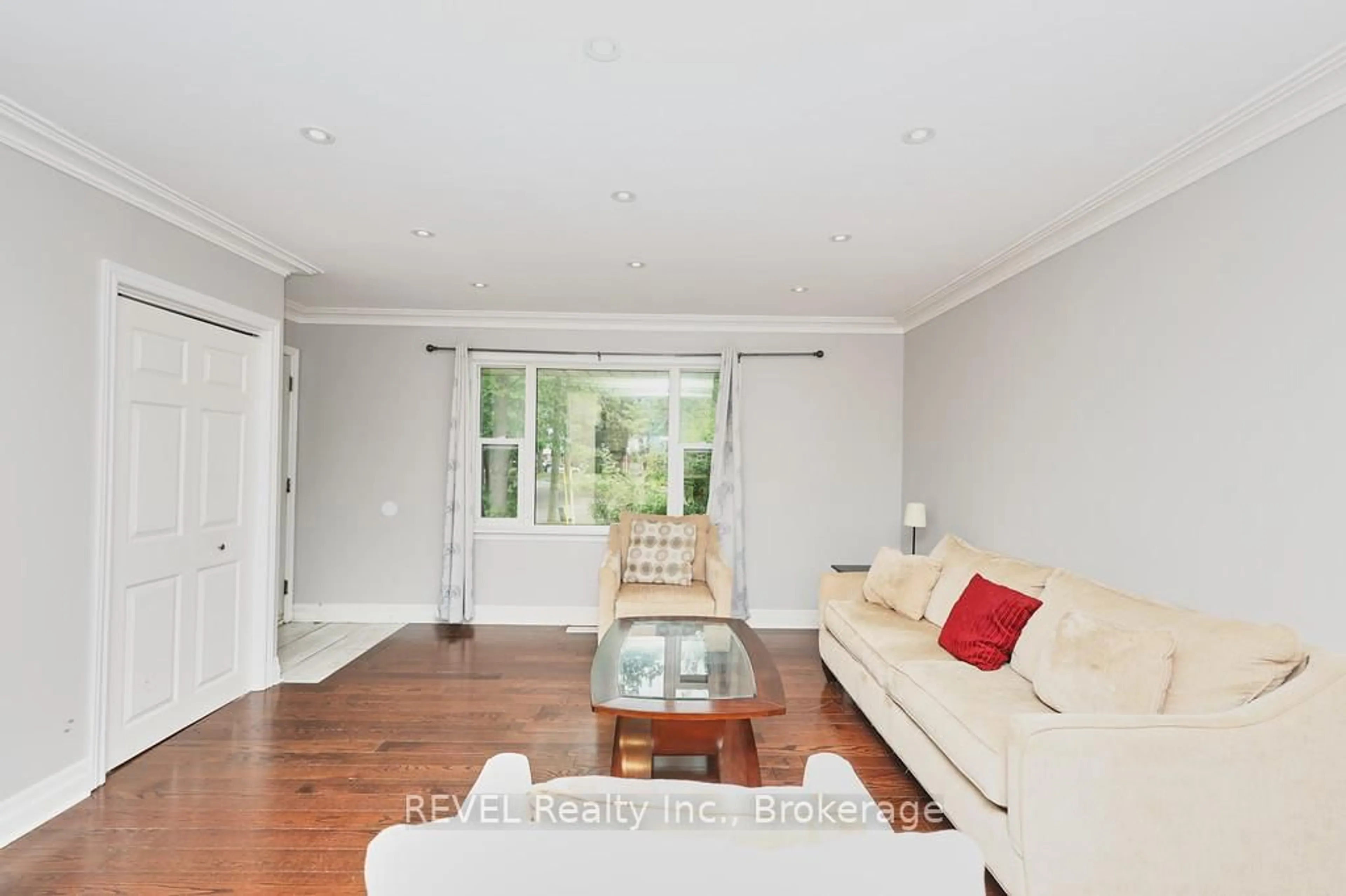 Living room with furniture, wood/laminate floor for 42 Chalmers St, St. Catharines Ontario L2M 5C8
