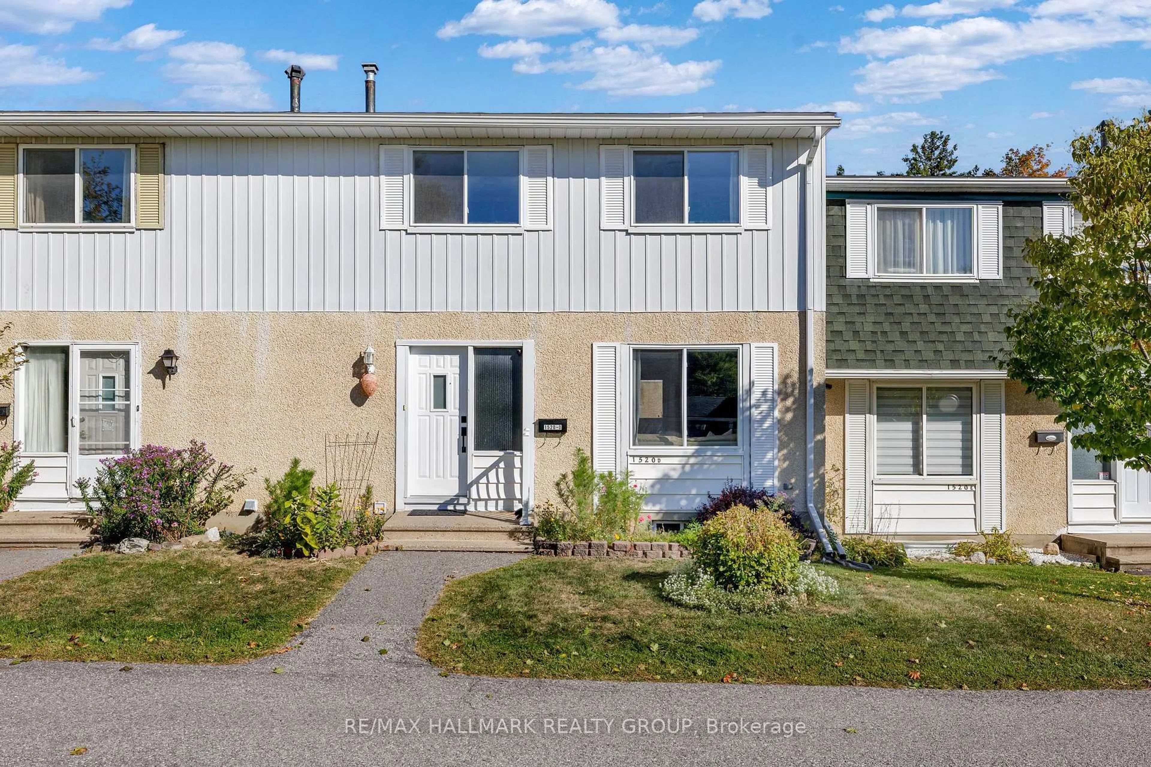 Home with vinyl exterior material, street for 1520 Beaverpond Dr #D, Ottawa Ontario K1B 3R9