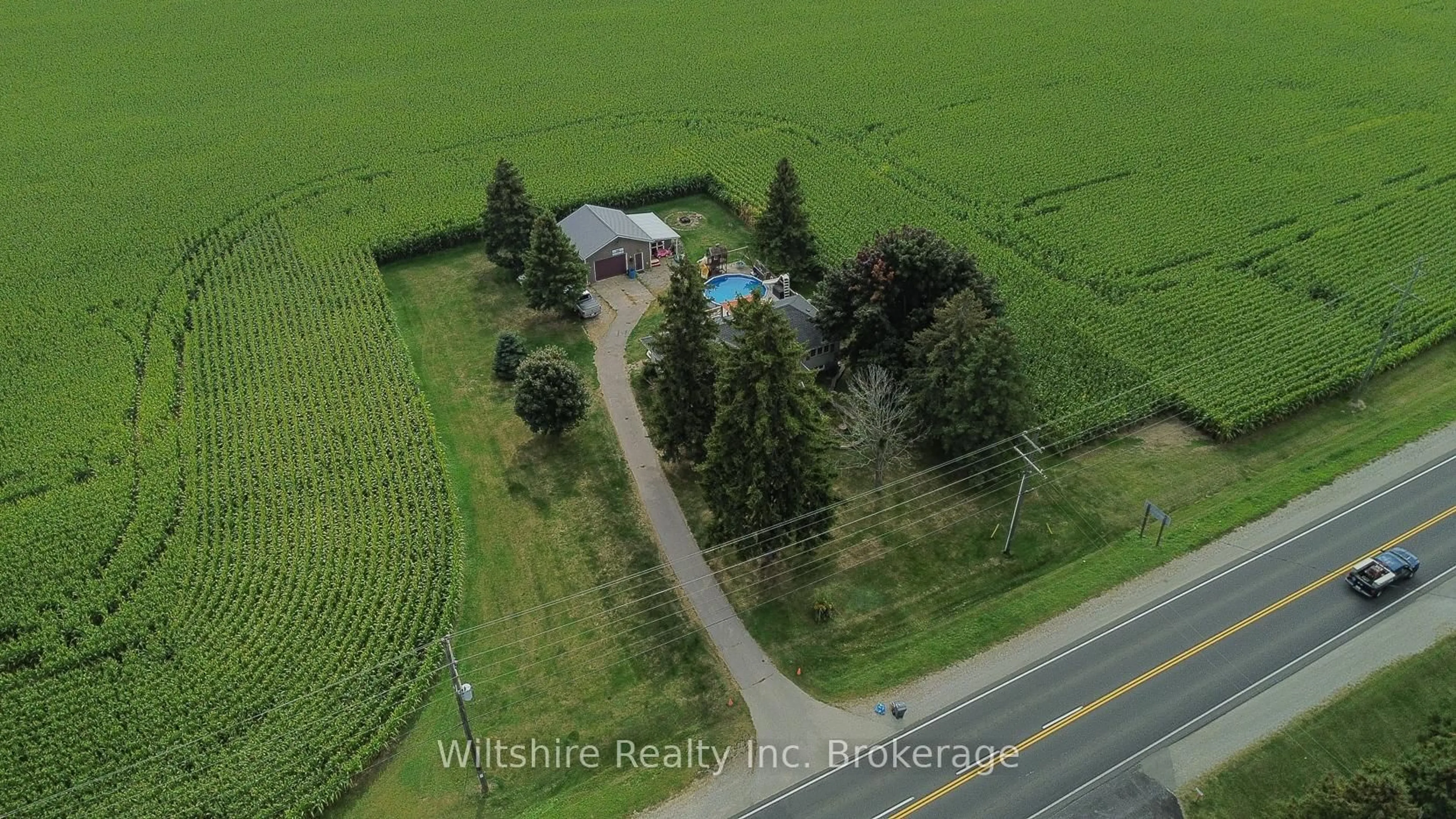 A pic from outside/outdoor area/front of a property/back of a property/a pic from drone, unknown for 47209 Talbot Line, Malahide Ontario N5P 3S7