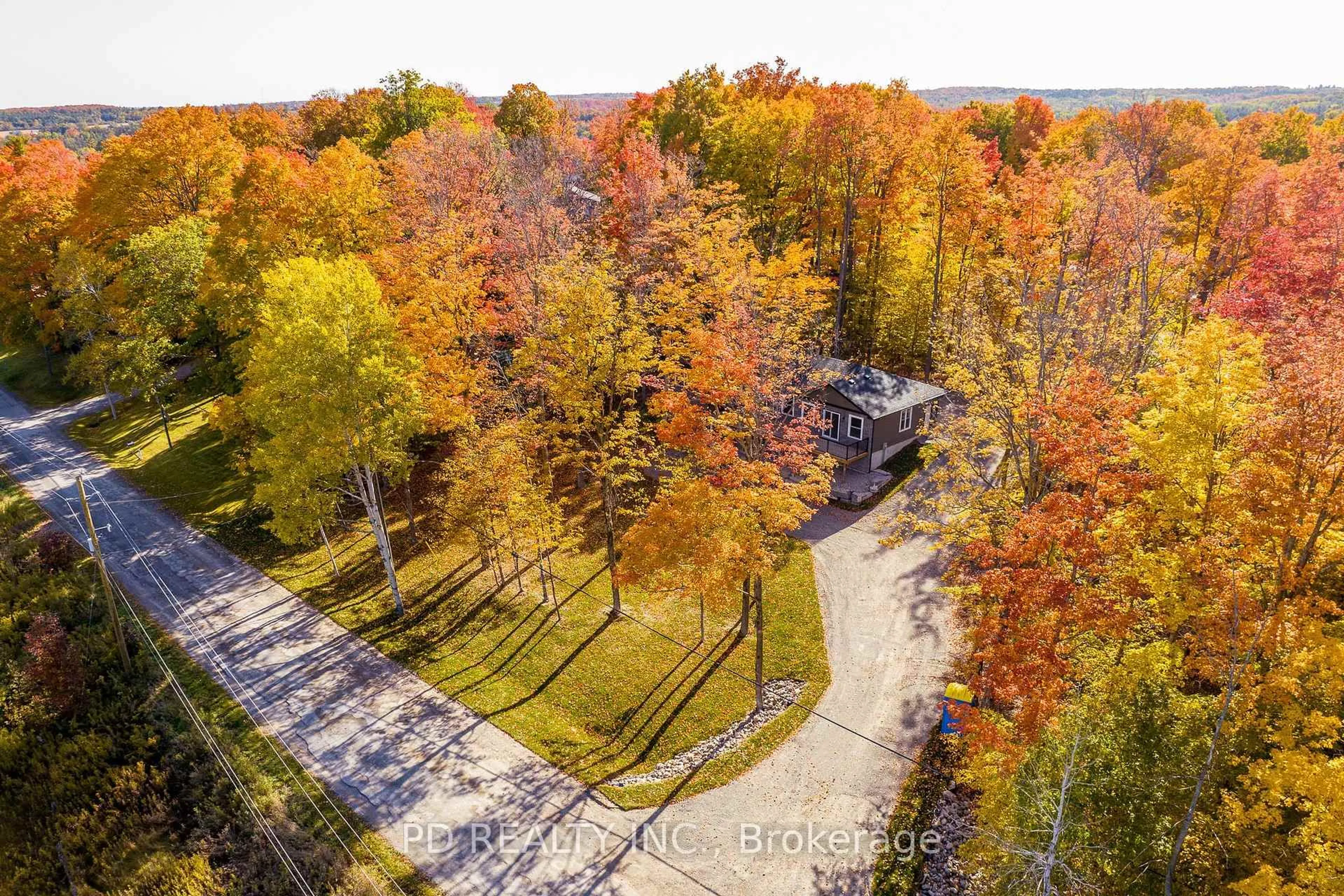 A pic from outside/outdoor area/front of a property/back of a property/a pic from drone, forest/trees view for 2 East St, Kawartha Lakes Ontario L0A 1A0
