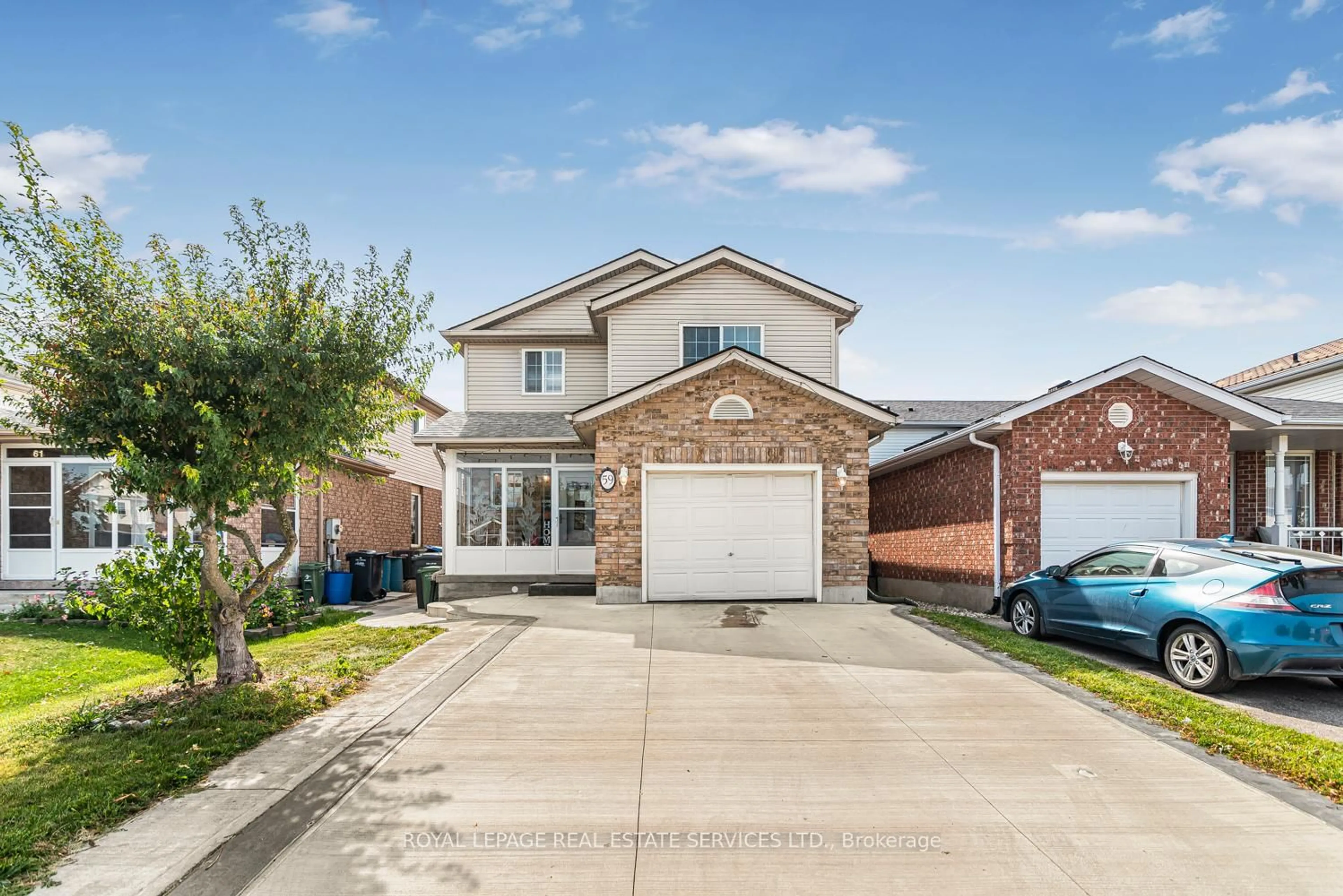 Home with brick exterior material, street for 59 Deerpath Dr, Guelph Ontario N1K 1V1