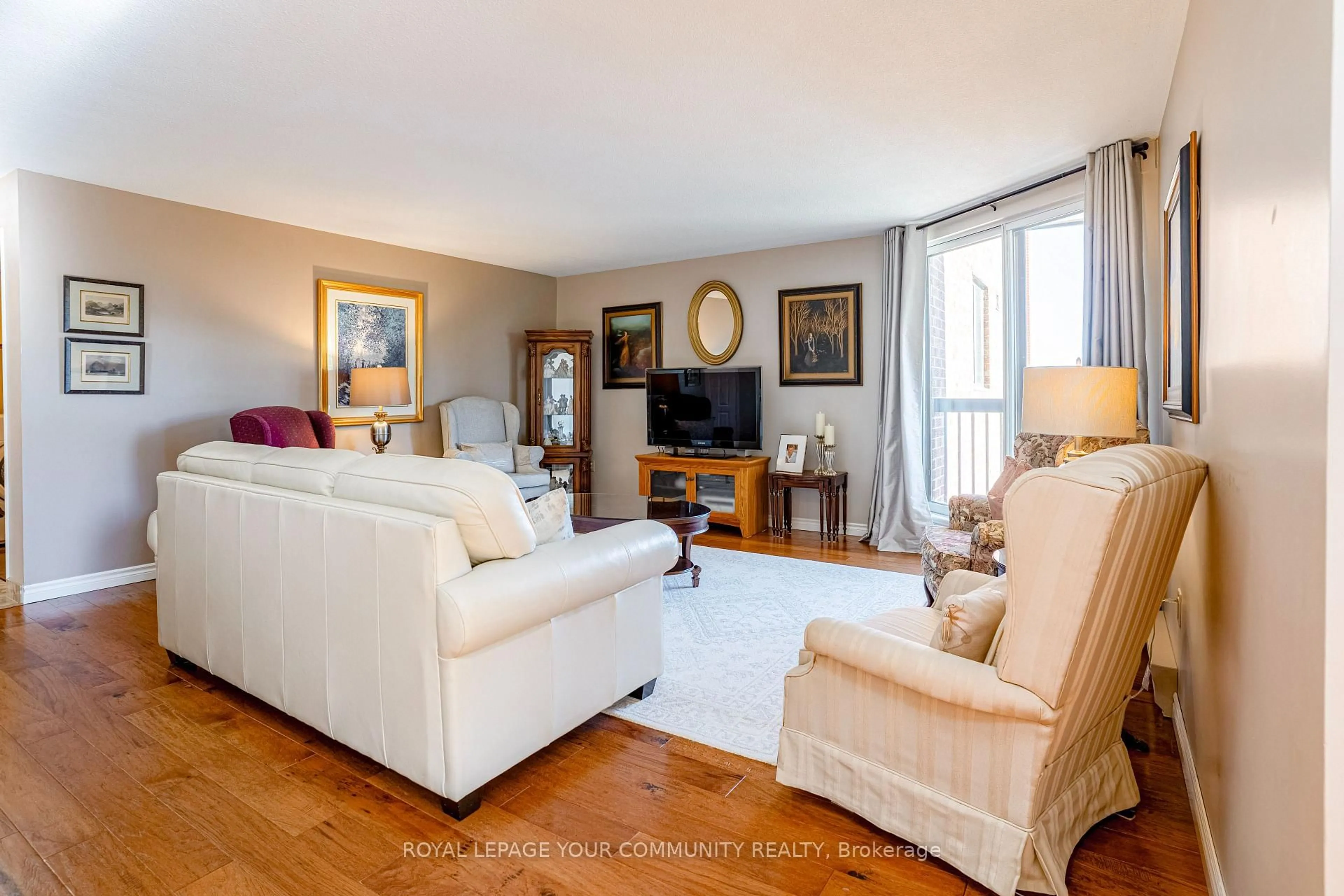 Living room with furniture, wood/laminate floor for 2000 Regent St #203, Greater Sudbury Ontario P3E 5T5