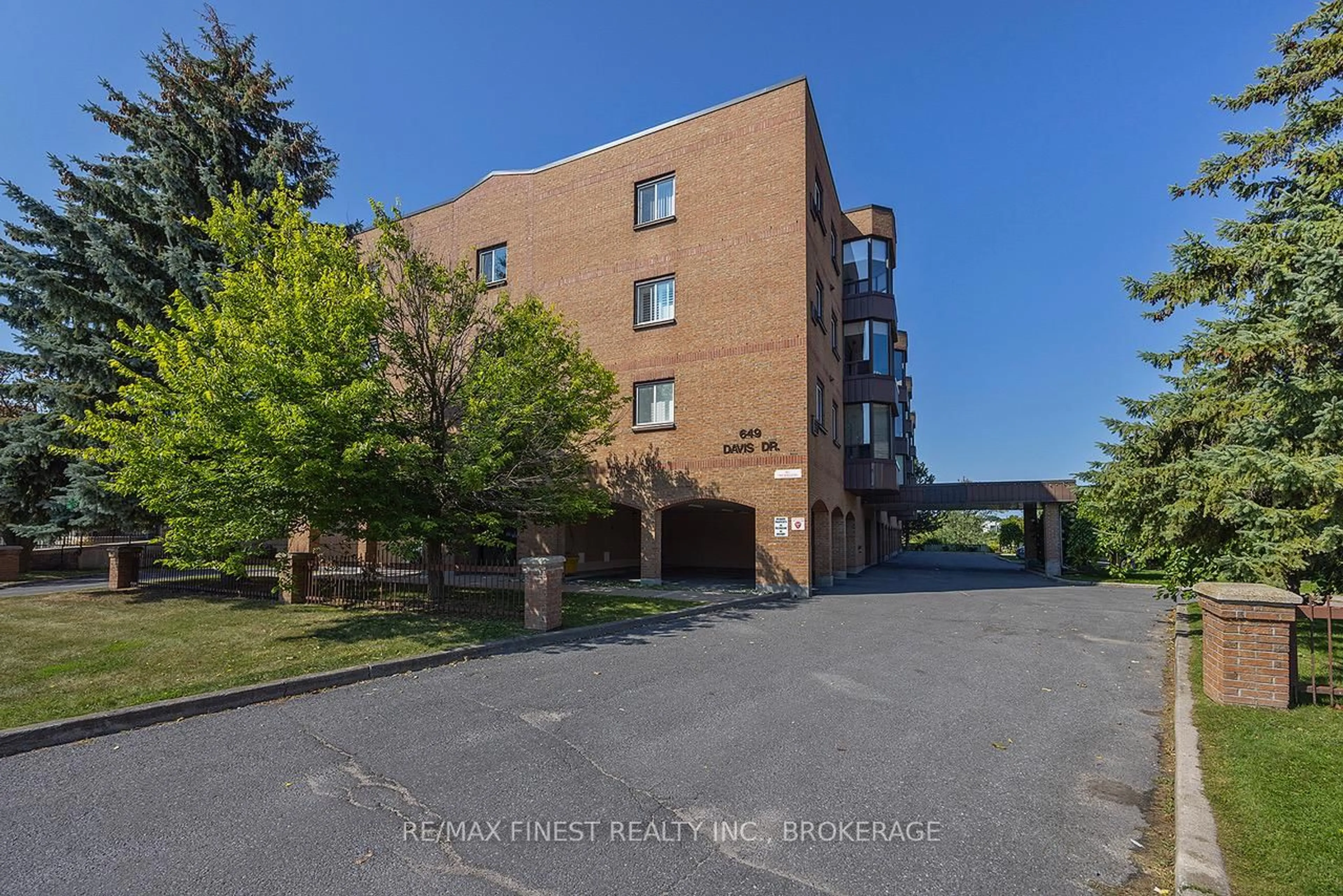A pic from outside/outdoor area/front of a property/back of a property/a pic from drone, unknown for 649 Davis Dr #405, Kingston Ontario K7M 8J3