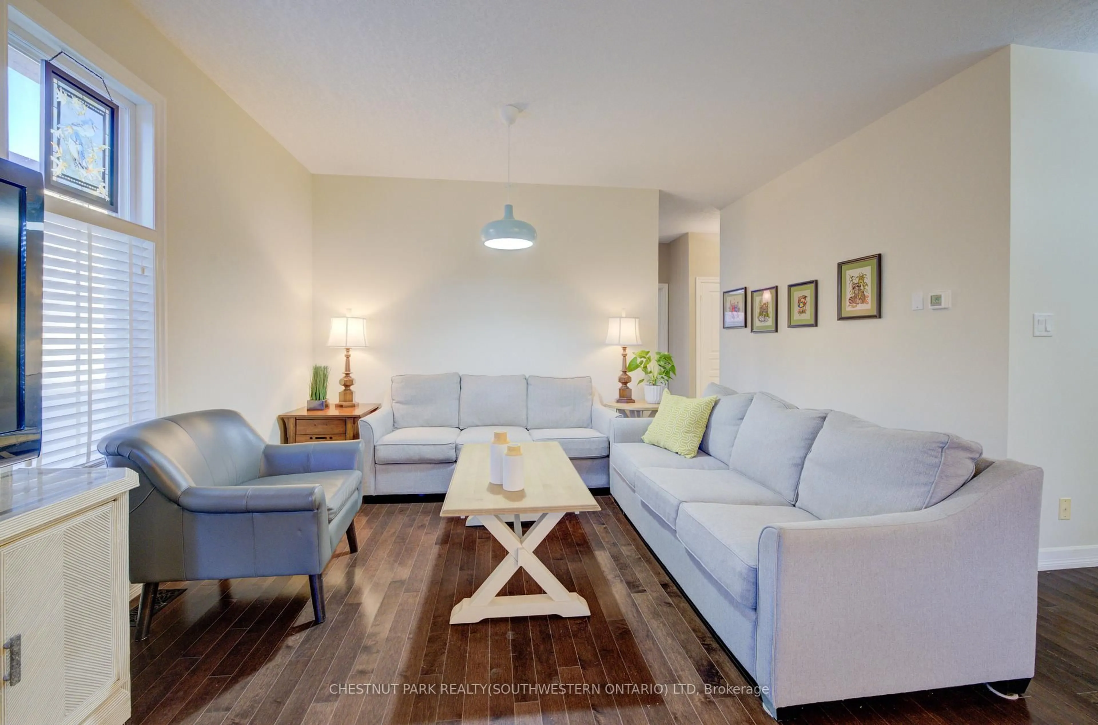 Living room with furniture, wood/laminate floor for 900 Doon Village Rd #15, Kitchener Ontario N2P 1A4
