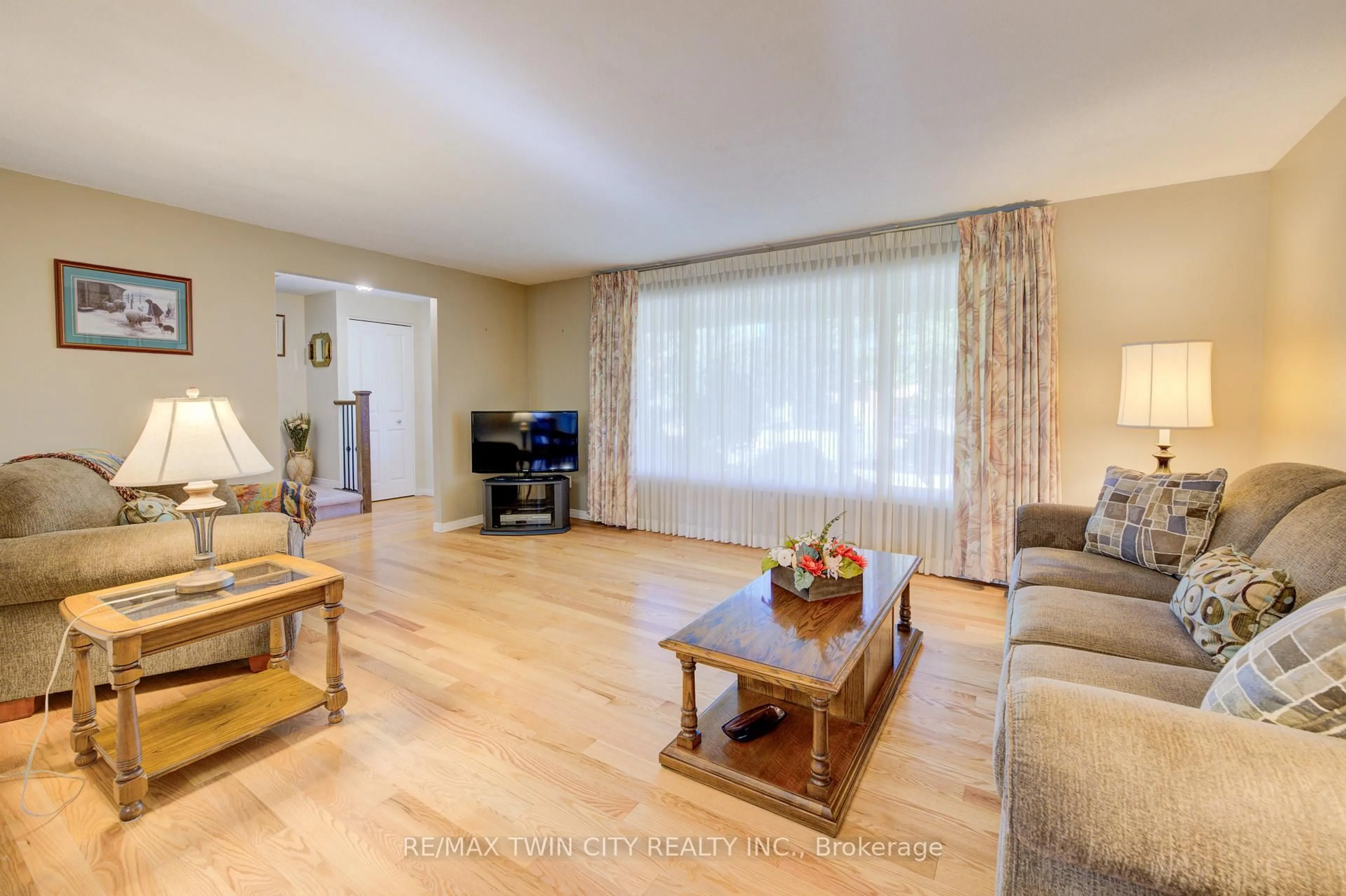 Living room with furniture, wood/laminate floor for 176 Morrison Rd, Kitchener Ontario N2A 2T4