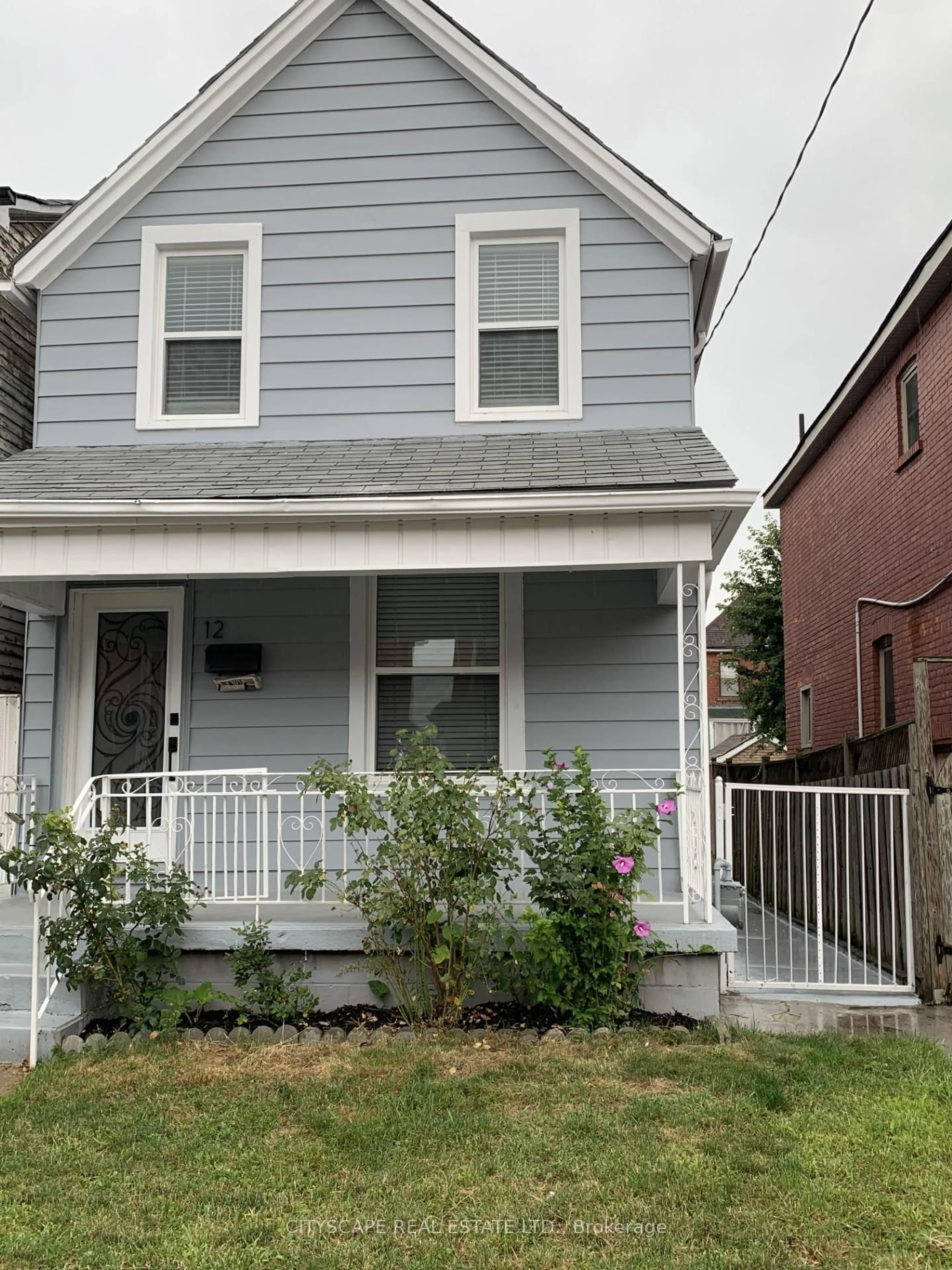 Home with vinyl exterior material, street for 12 Kinrade Ave, Hamilton Ontario L8L 6L6