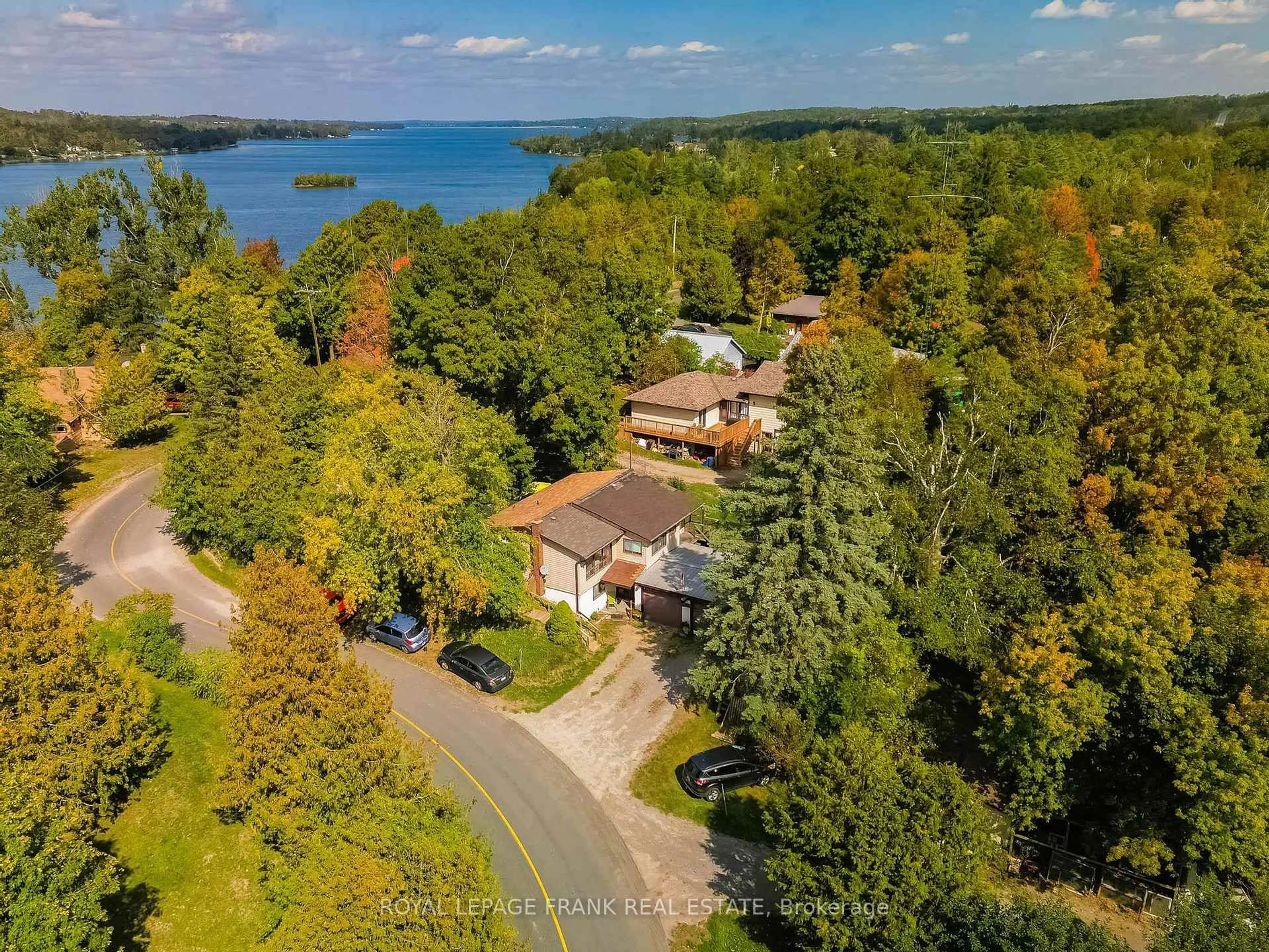 A pic from outside/outdoor area/front of a property/back of a property/a pic from drone, water/lake/river/ocean view for 153 Fifes Bay Rd, Selwyn Ontario K9J 6X3
