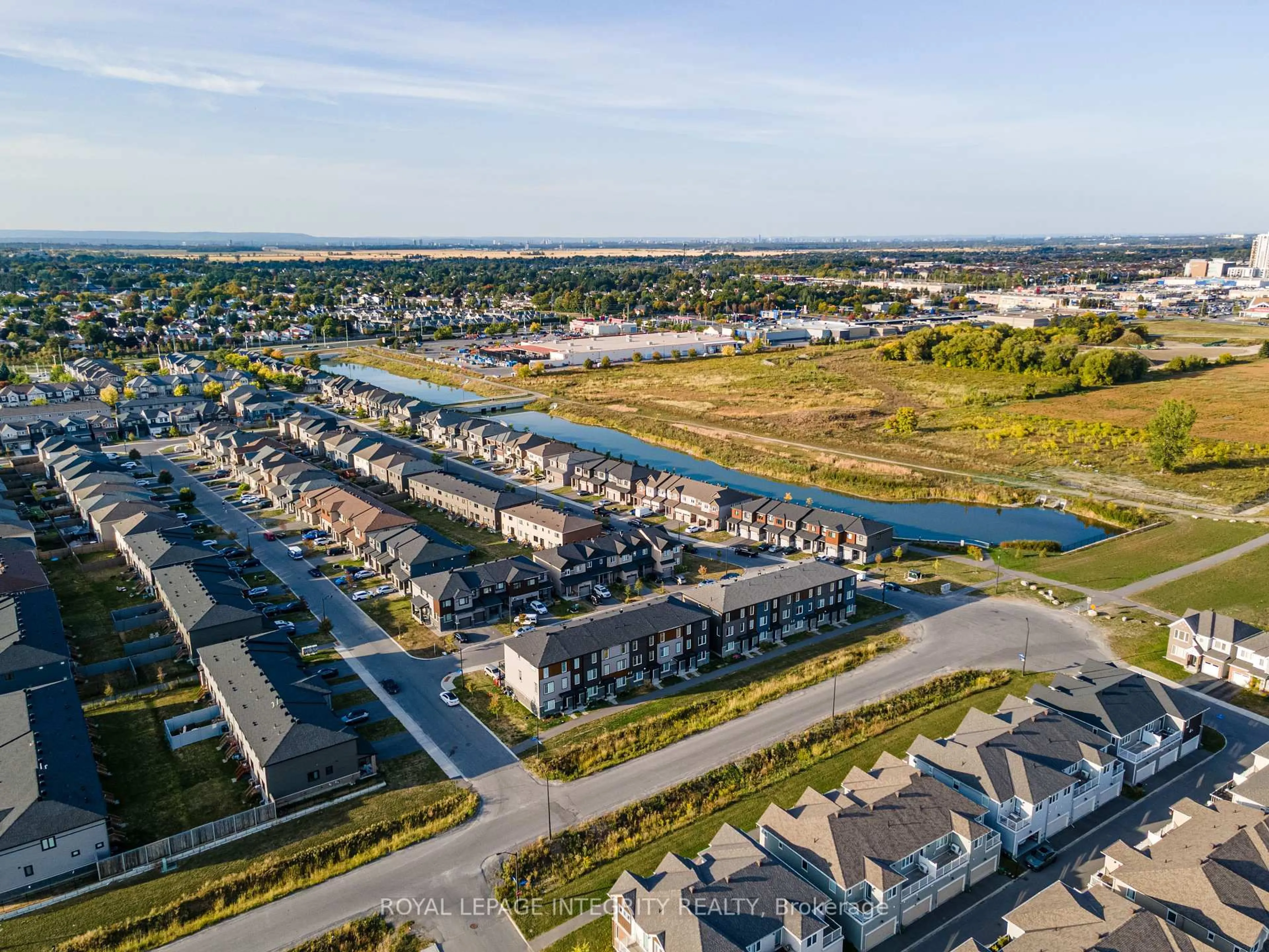 A pic from outside/outdoor area/front of a property/back of a property/a pic from drone, water/lake/river/ocean view for 806 Everbloom Lane, Ottawa Ontario K2J 6Z6
