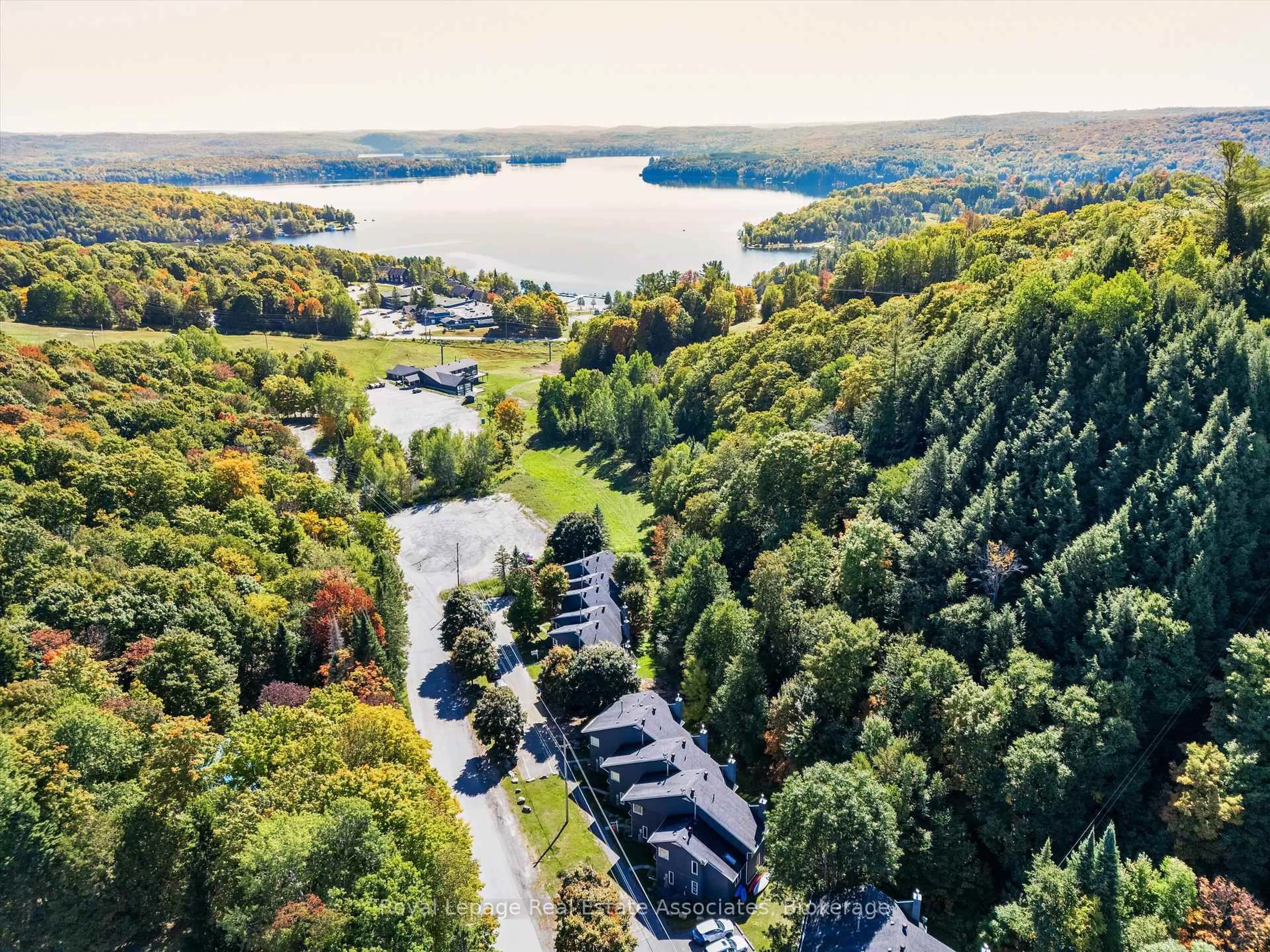 A pic from outside/outdoor area/front of a property/back of a property/a pic from drone, water/lake/river/ocean view for 1581 Hidden Valley Rd #16, Huntsville Ontario P1H 1A4