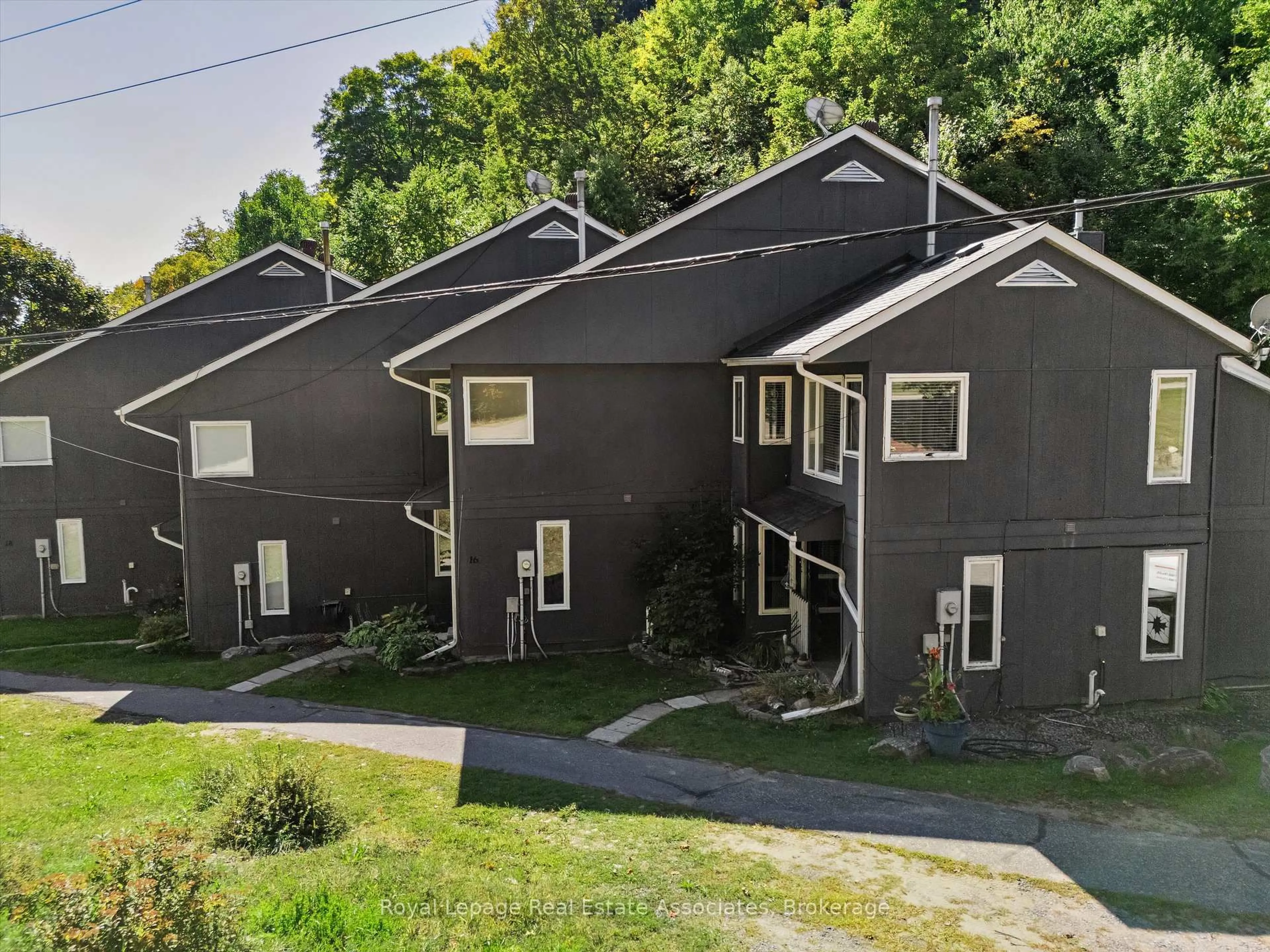 A pic from outside/outdoor area/front of a property/back of a property/a pic from drone, street for 1581 Hidden Valley Rd #16, Huntsville Ontario P1H 1A4