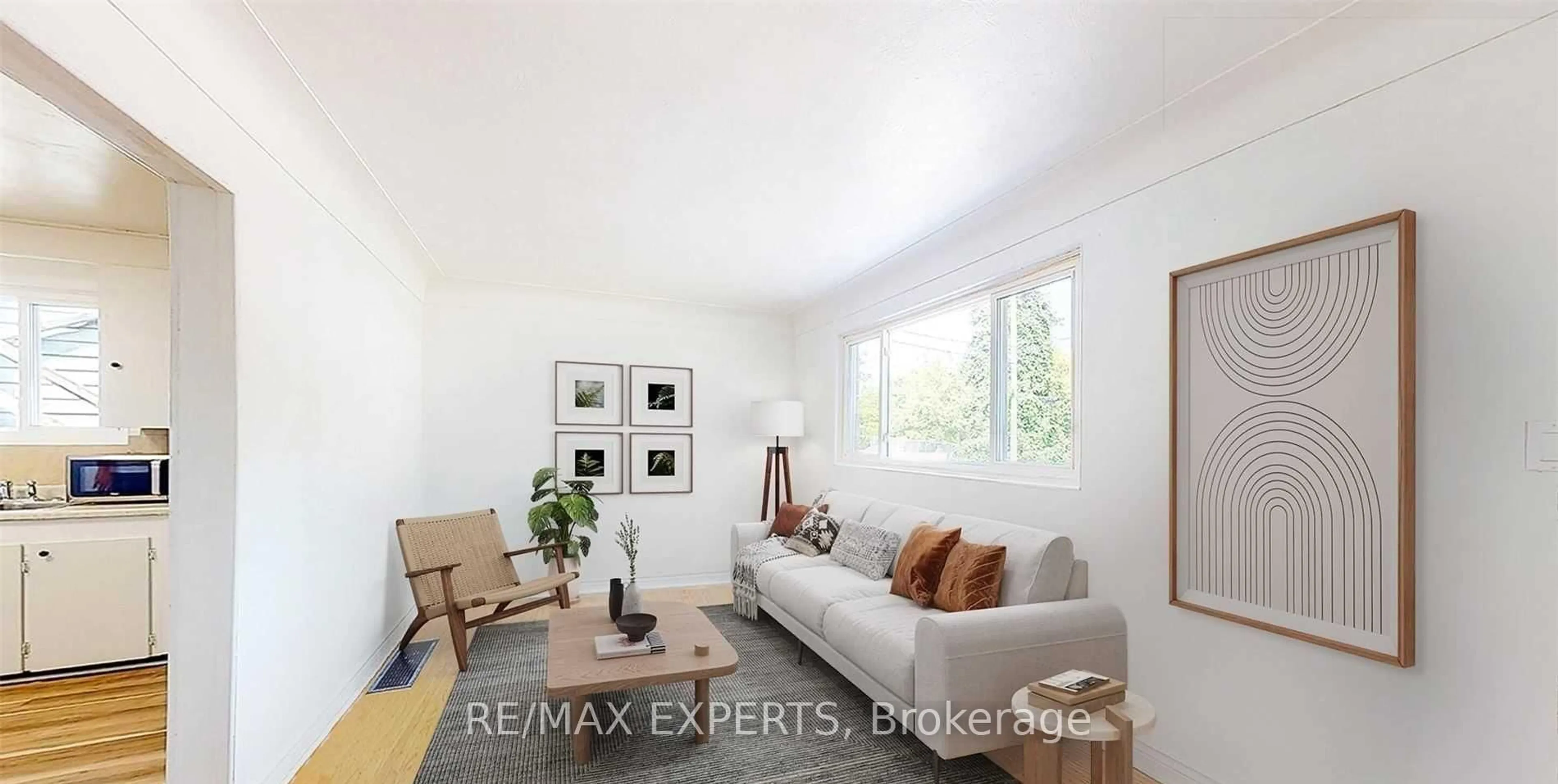 Living room with furniture, wood/laminate floor for 153 Ward Ave, Hamilton Ontario L8S 2G1