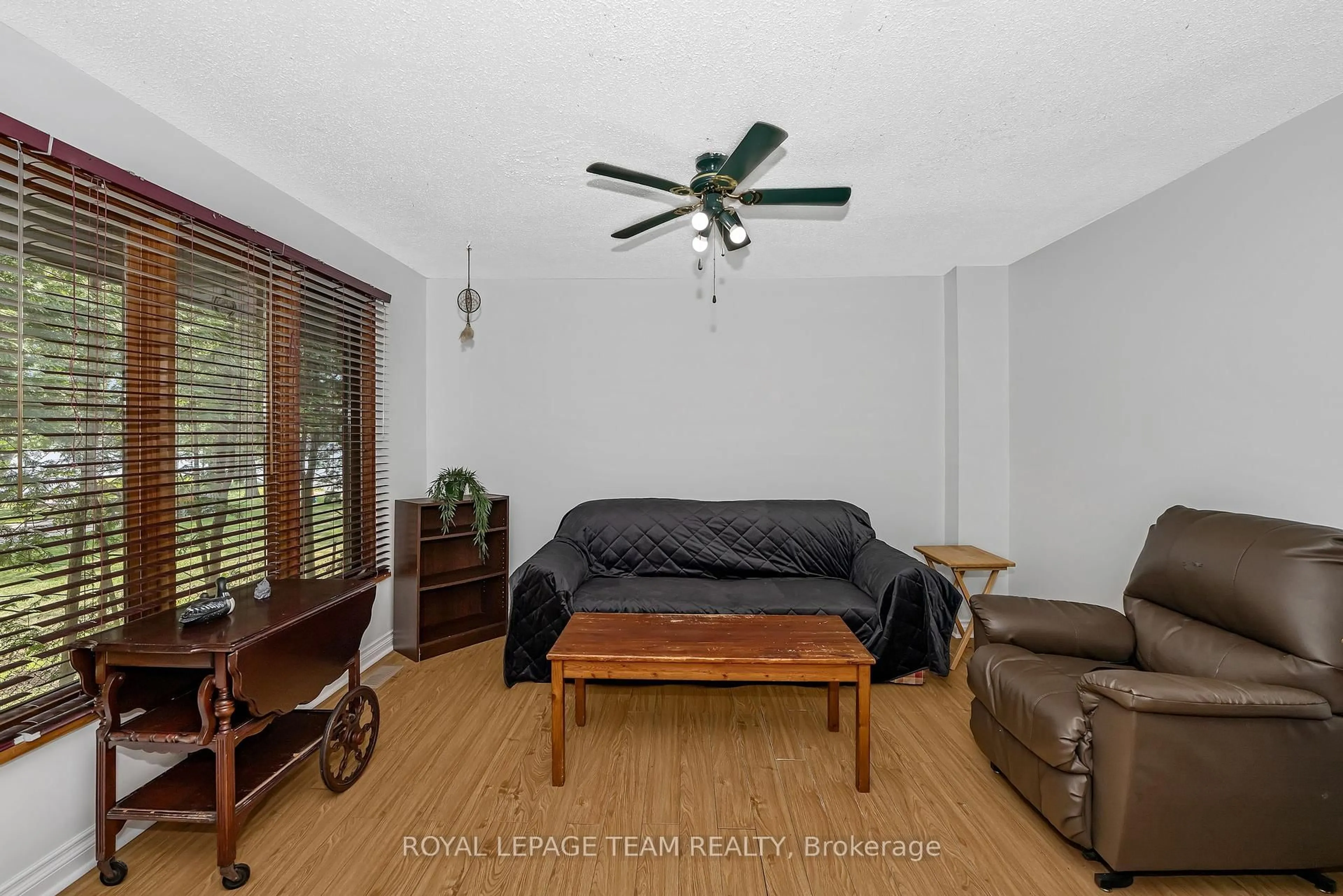 Living room with furniture, wood/laminate floor for 1210 Bayview Dr, Ottawa Ontario K0A 3M0