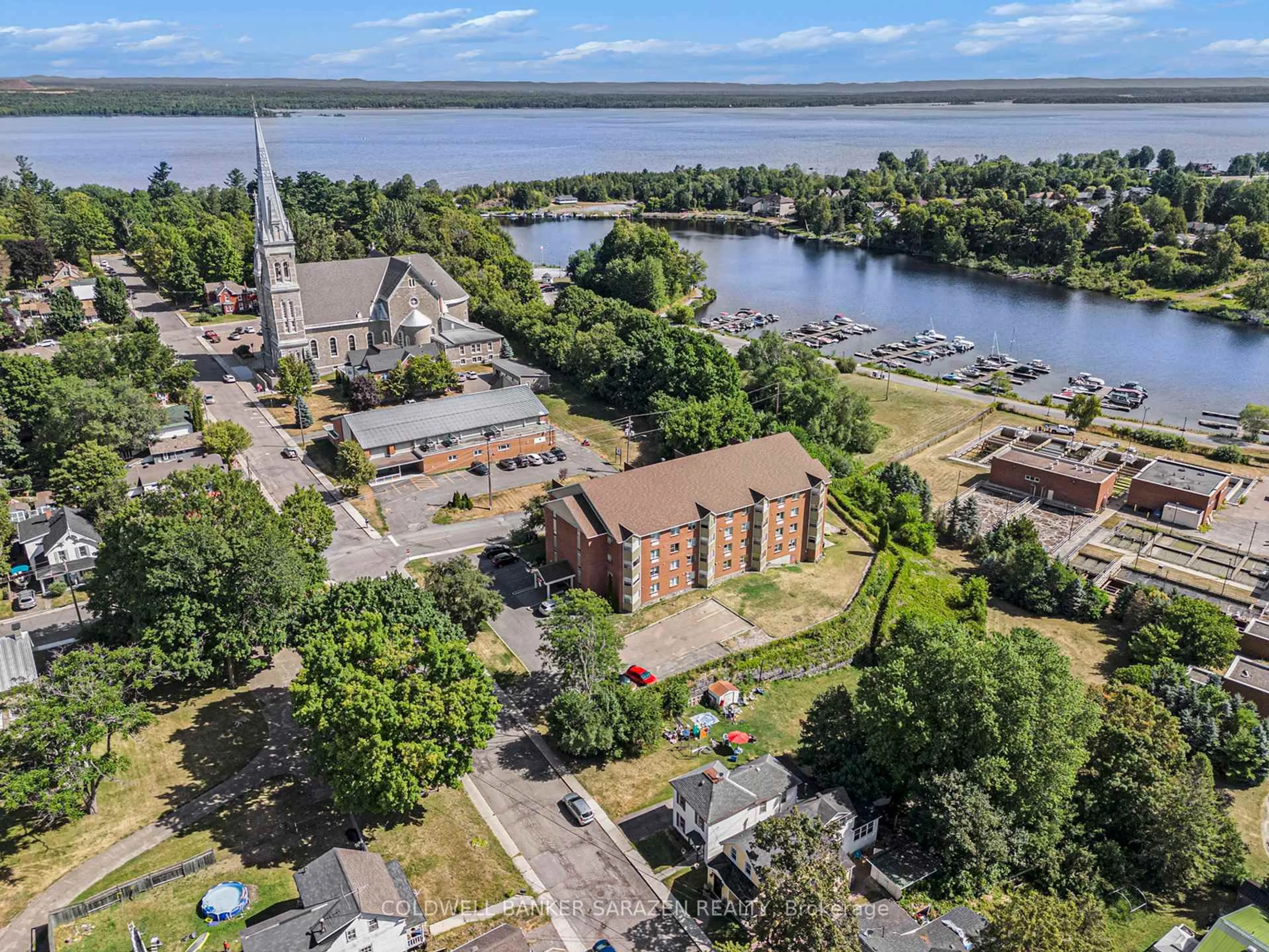 A pic from outside/outdoor area/front of a property/back of a property/a pic from drone, water/lake/river/ocean view for 259 Albert St #107, Arnprior Ontario K7S 2M4